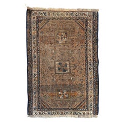 Antique distressed Shiraz rug