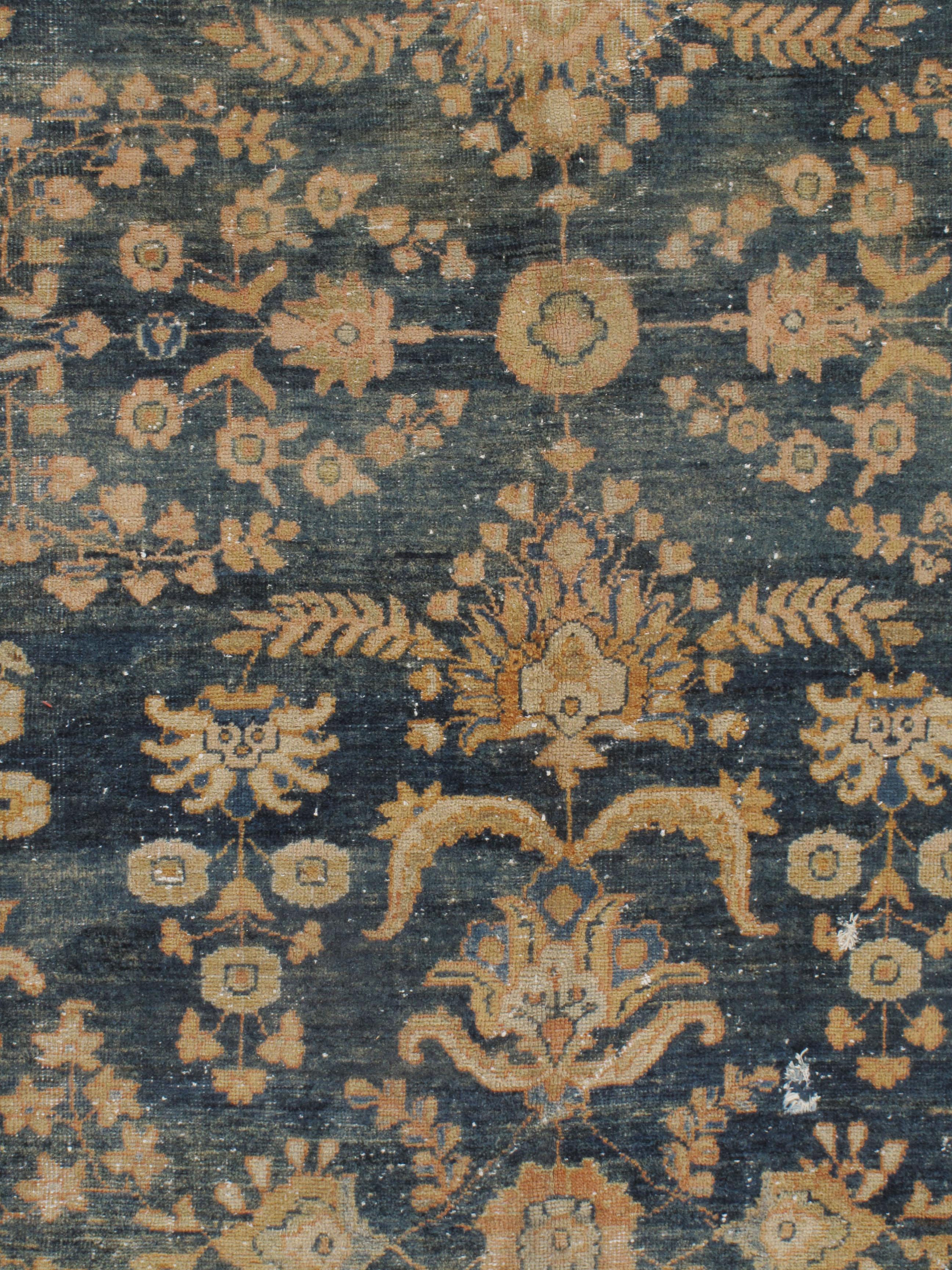 Antique distressed Sultanabad rug. Distressed, shabby chic. The rug is solid but with low pile and a distressed look that adds to its beauty and charm. The rug has a solid foundation and will stand up to the rigors of normal daily use. Size: 8'3 x