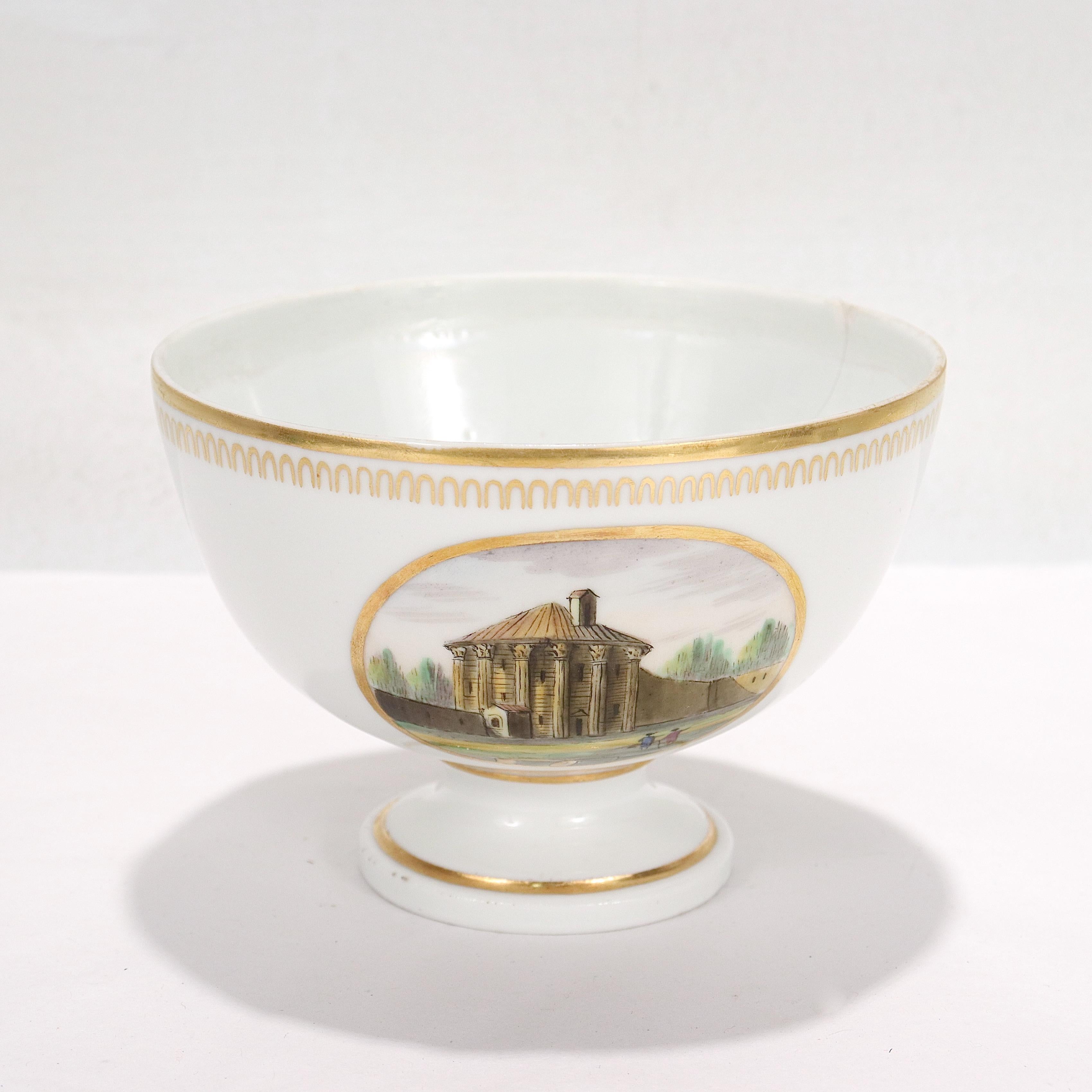 A fine antique topographical porcelain waste bowl.

By Doccia porcelain manufactory circa 1820.

With painted enamel topographical scenes, one different to each side.

Decorated in polychrome enamels and gilt borders in the neoclassical