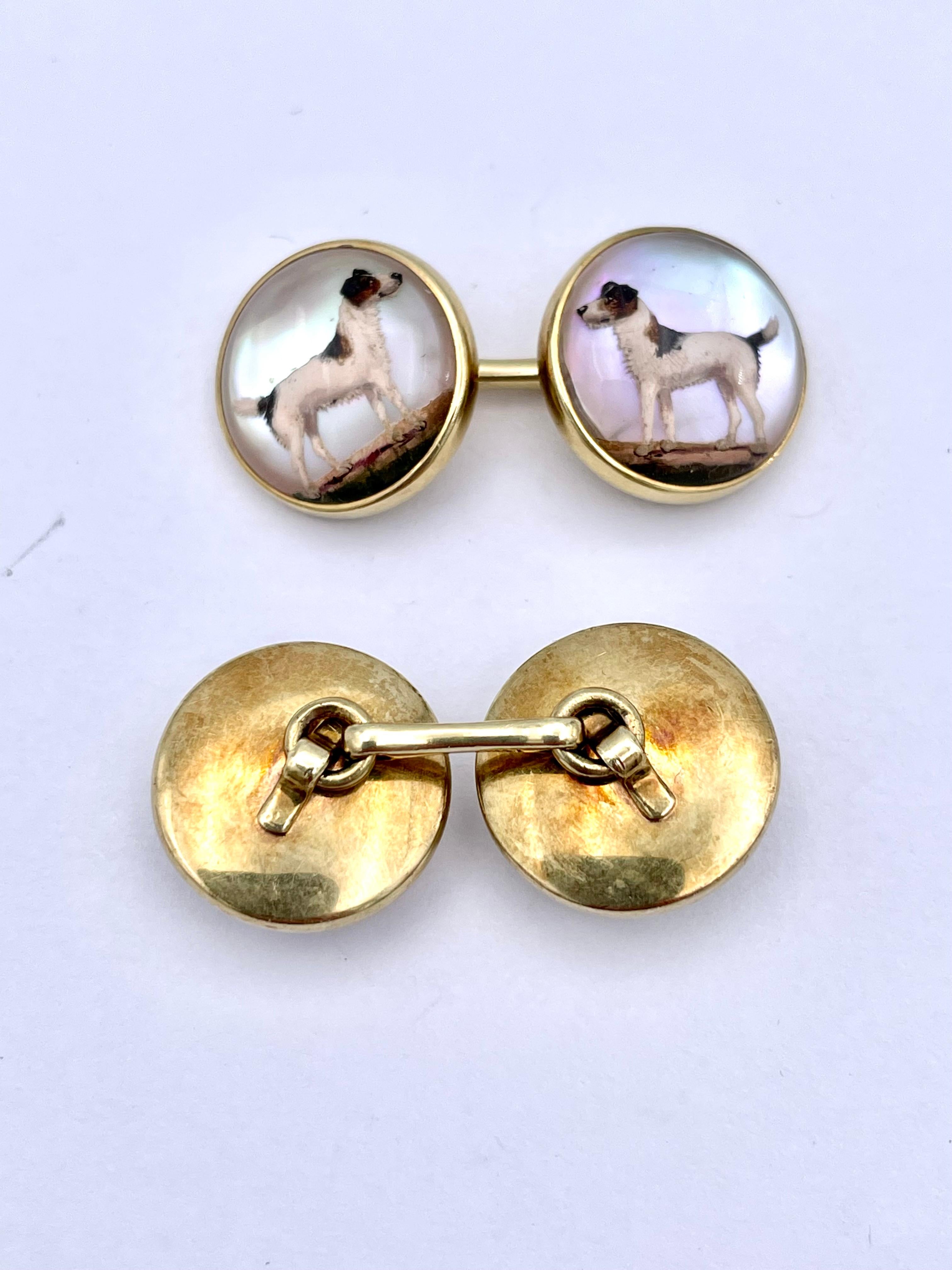 Beautiful double-sided  reverse crystal cufflinks:  hand-painted renditions of setter dogs in bright white, brown and black enamel.  Set against a luminous mother-of-pearl background.  Set in 14K yellow gold.  So finely detailed that you can see the