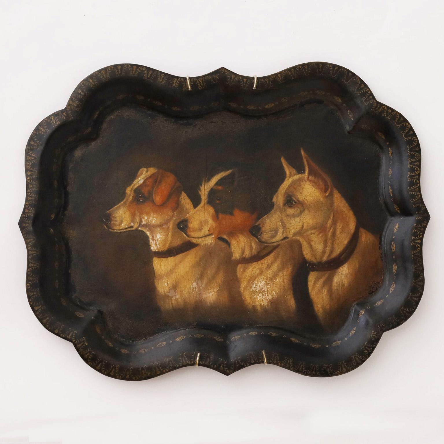 Lofty pair of 19th century scalloped tole serving trays now wall hangings each masterfully painted with portraits and spirits of three dogs including terriers, a retriever, and a pug forever angels. Priced individually.