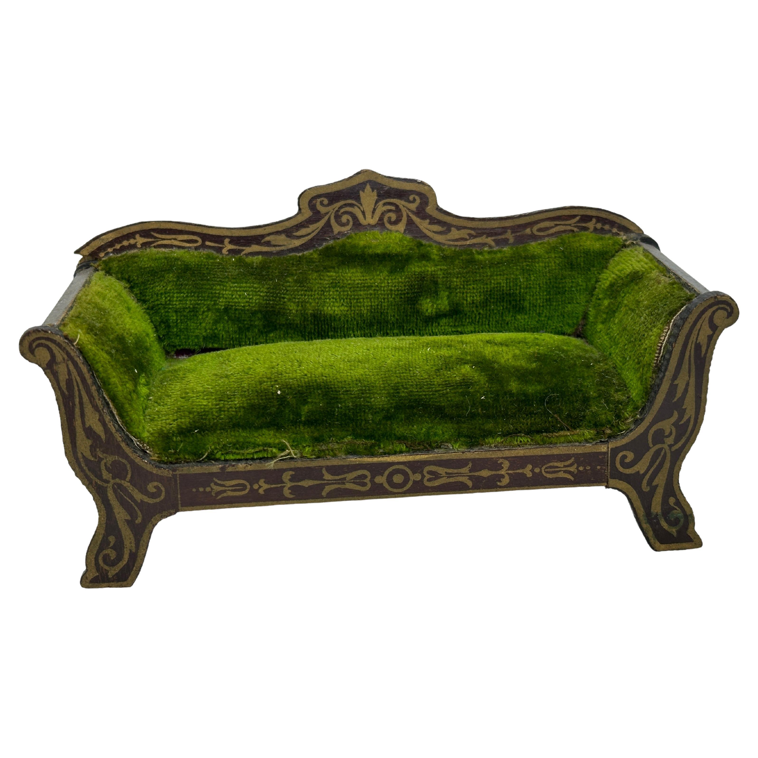 This rare and exquisite miniature antique German wooden Boulle sofa with original velvet upholstery and fine golden transfers, dated about 1890. Made by one the famous German toy companies. A very lovely sofa for antique dolls and for dollhouses.