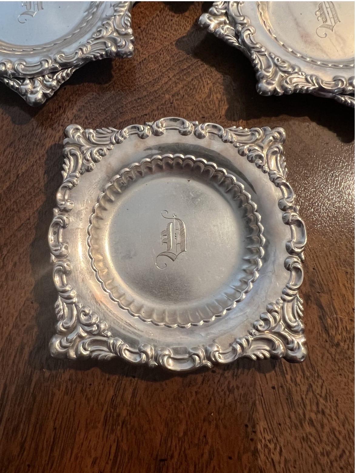 Set of 11 antique early 20th century sterling silver butter pats by Dominick & Haff. Each with a “D” monogram to bowl and hand chased border. Each roughly 26 grams - 289grams total weight.