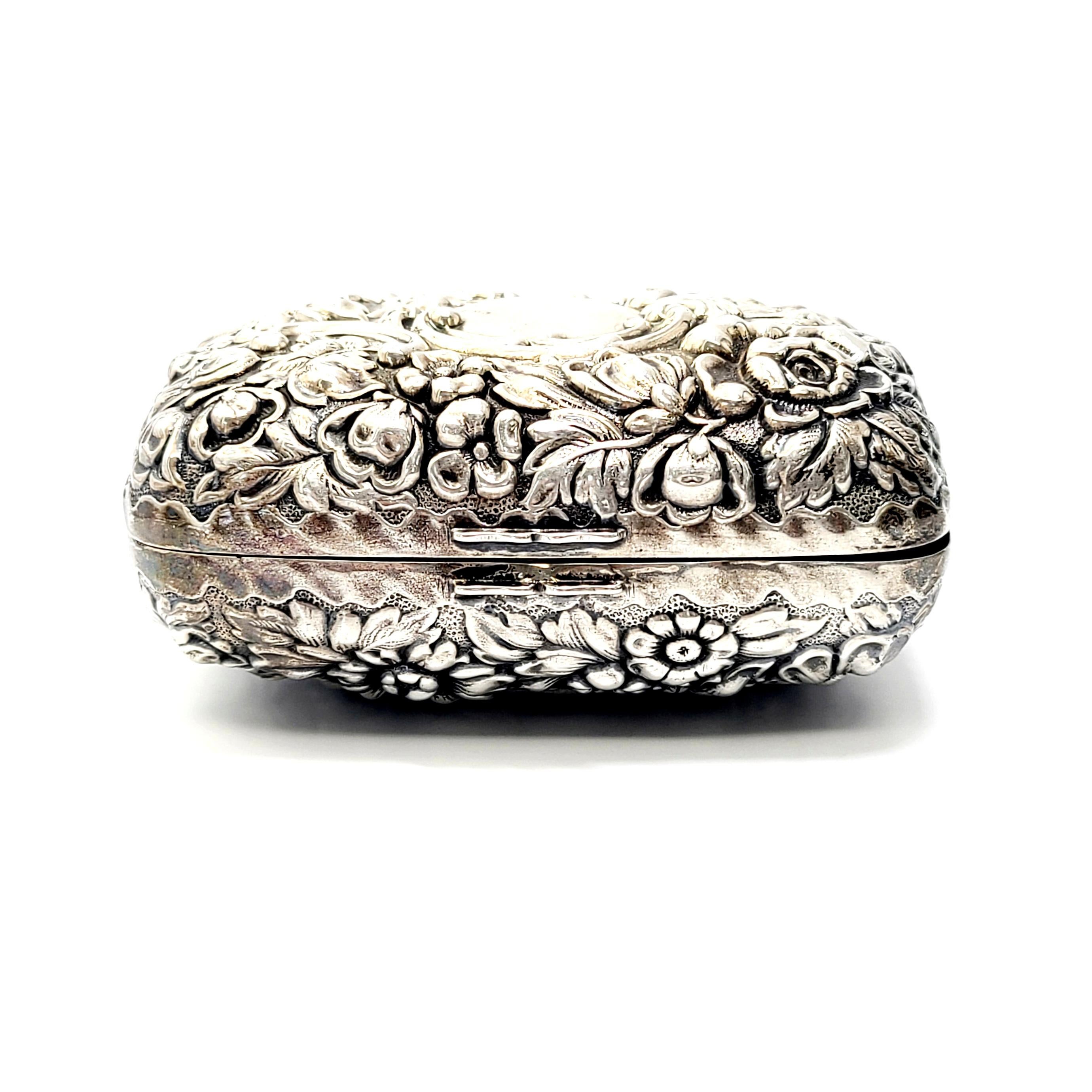 Antique sterling silver repousse soap box by Dominick & Haff.

Dominick & Haff of NY, NY from 1868-1928 designed this beautifully ornate repousse flower design soap box. There is blank smooth polished cartouche that is not monogrammed, but perfect