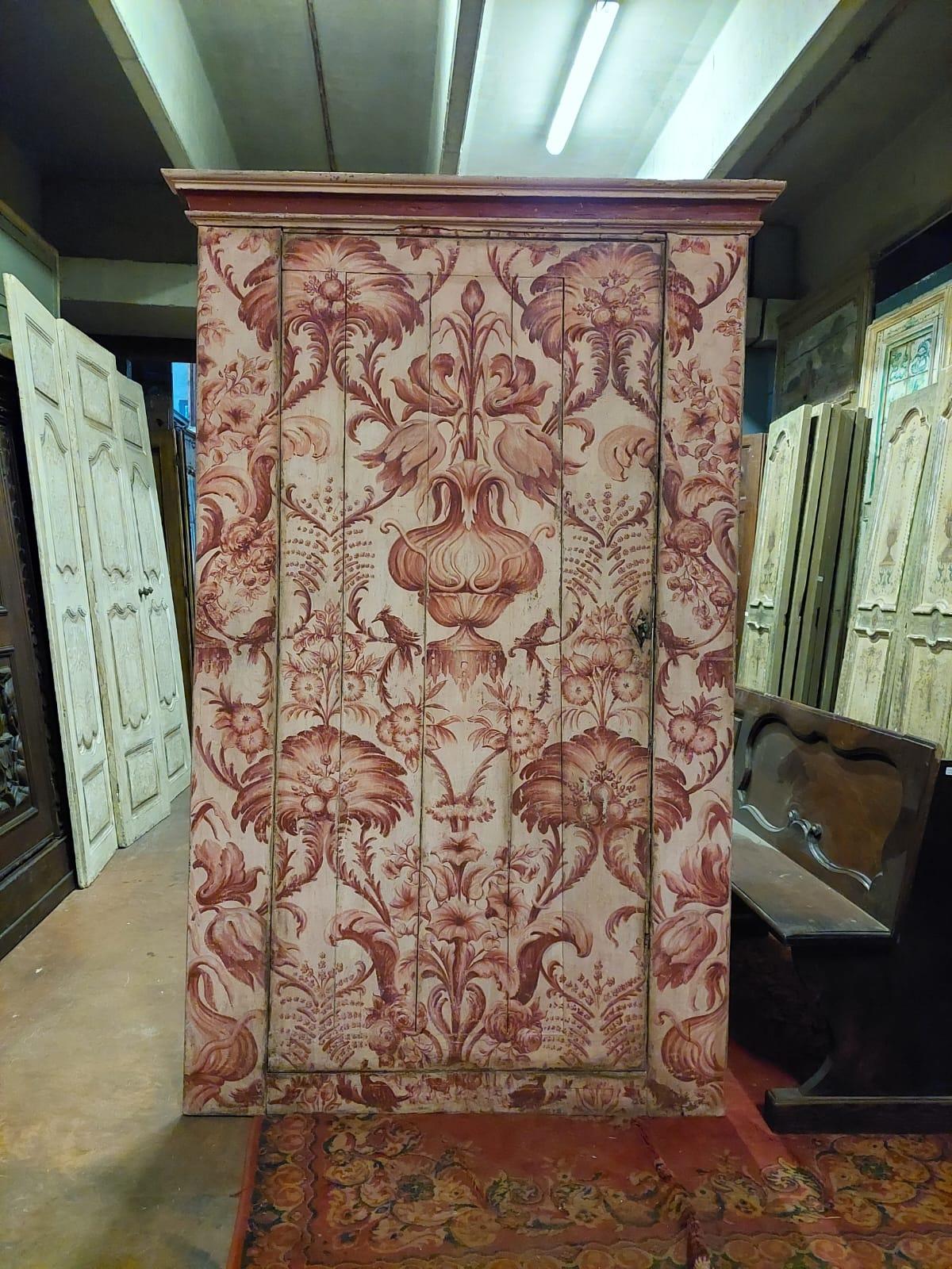 Ancient door for a built-in wardrobe, richly painted with floral motifs typical of the upholstery of the time, finished and in excellent state of conservation, with its frame closed underneath (it could also be transformed into a through door),