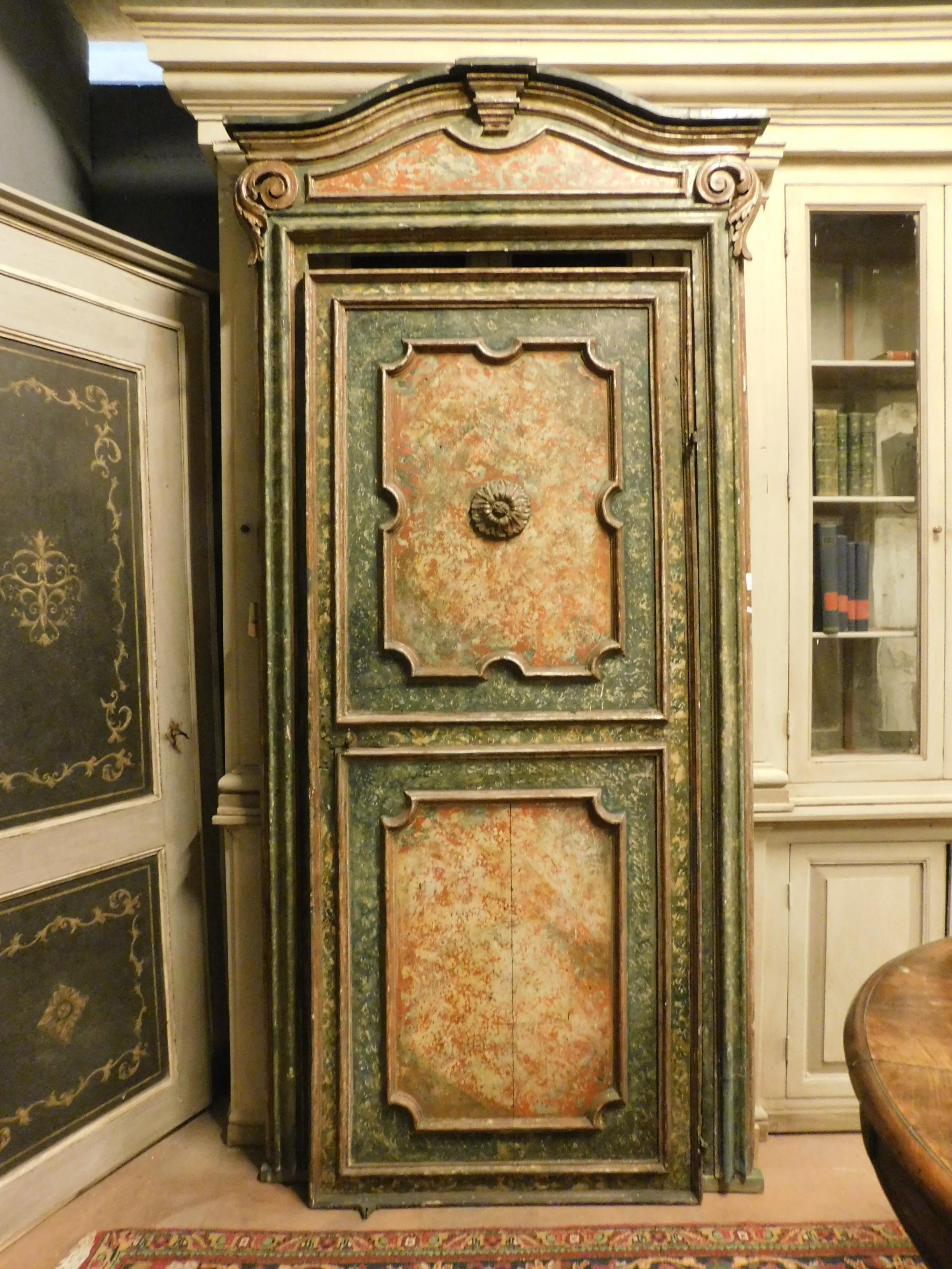 Antique lacquered door, hand painted with faux marble effect, yellow, orange and green colors, decorated on both sides, well sculpted and colored silver leaf molure, with original frame and irons from the Classic, 17th century, produced by a master