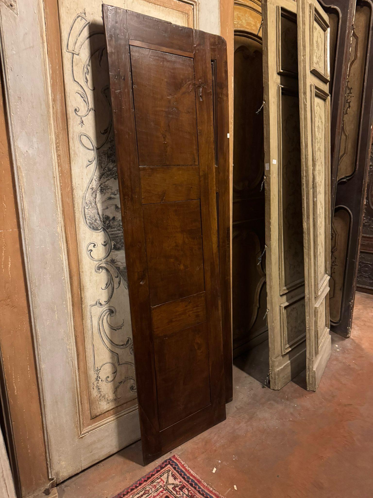 Hand-Carved Antique door in walnut wood, two leaves with carved panels, Italy For Sale