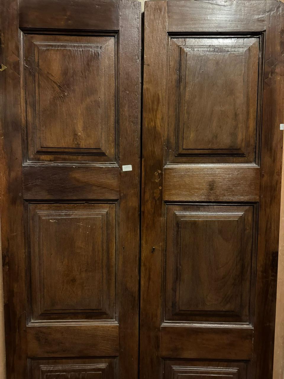 18th Century and Earlier Antique door in walnut wood, two leaves with carved panels, Italy For Sale