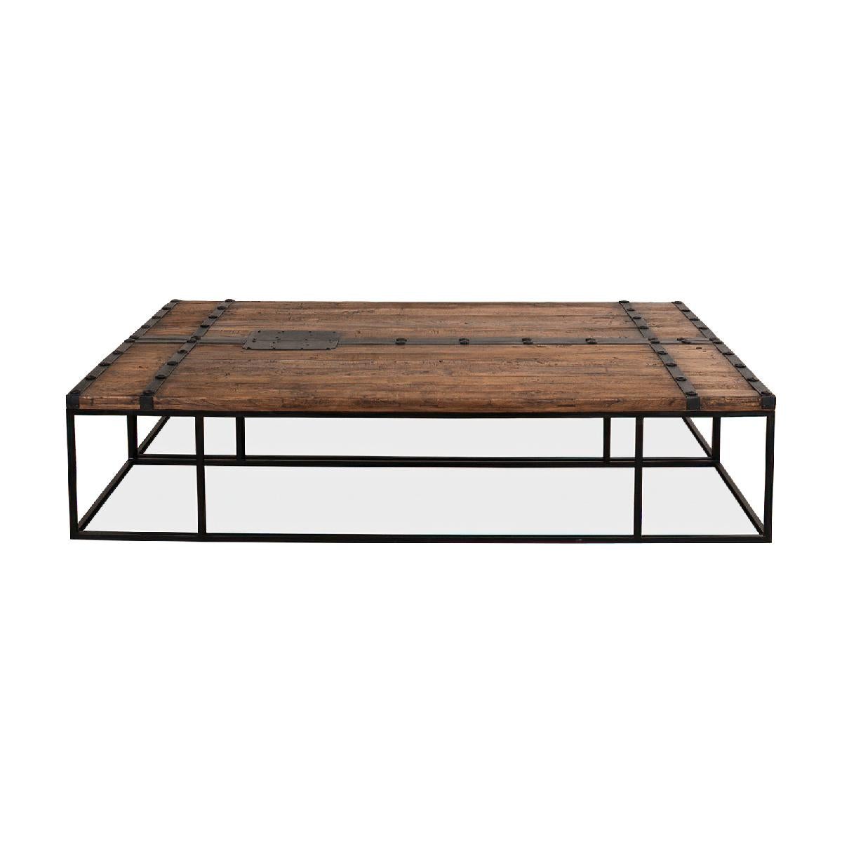 An antique door coffee table made from reclaimed elm doors and accented with iron hardware. This unique piece has a natural weathered wood top and rests on an iron base. Tables can be adjoined to be used as one large table or can be separated for a