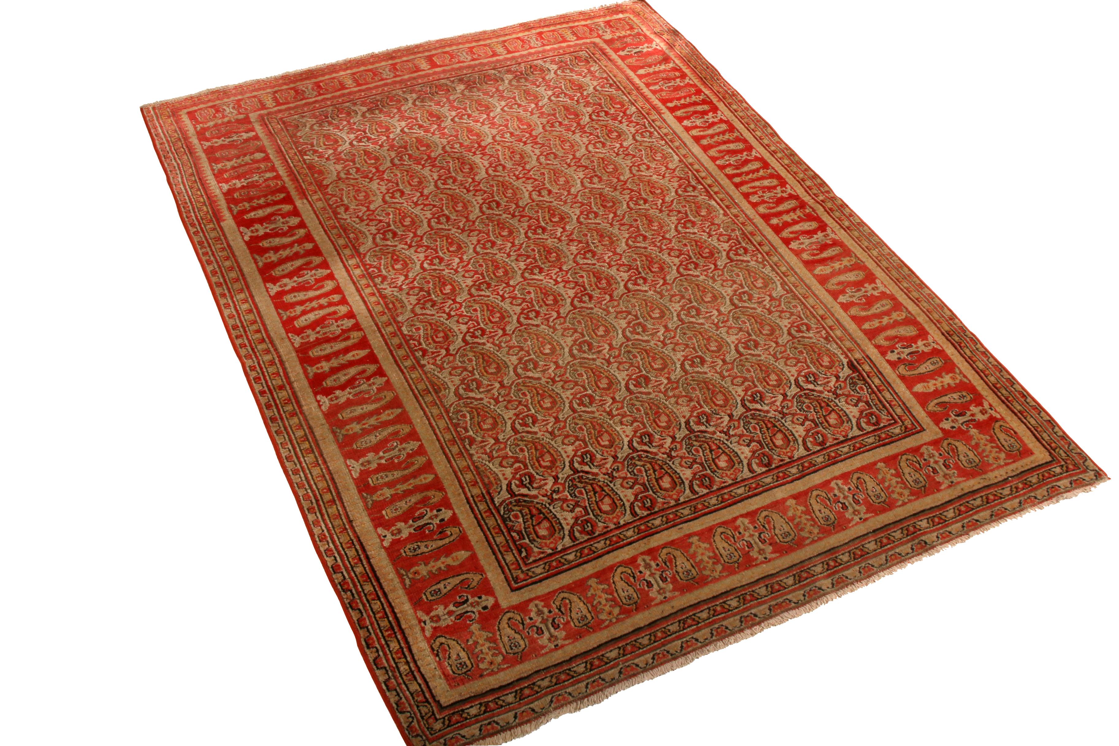 Hand knotted in wool originating from the Persian province of the same name between 1900-1910, this antique Doroksh rug hails from a region acclaimed for rarities ideal for interior decoration, employing a notably rich traditional colorway in pair