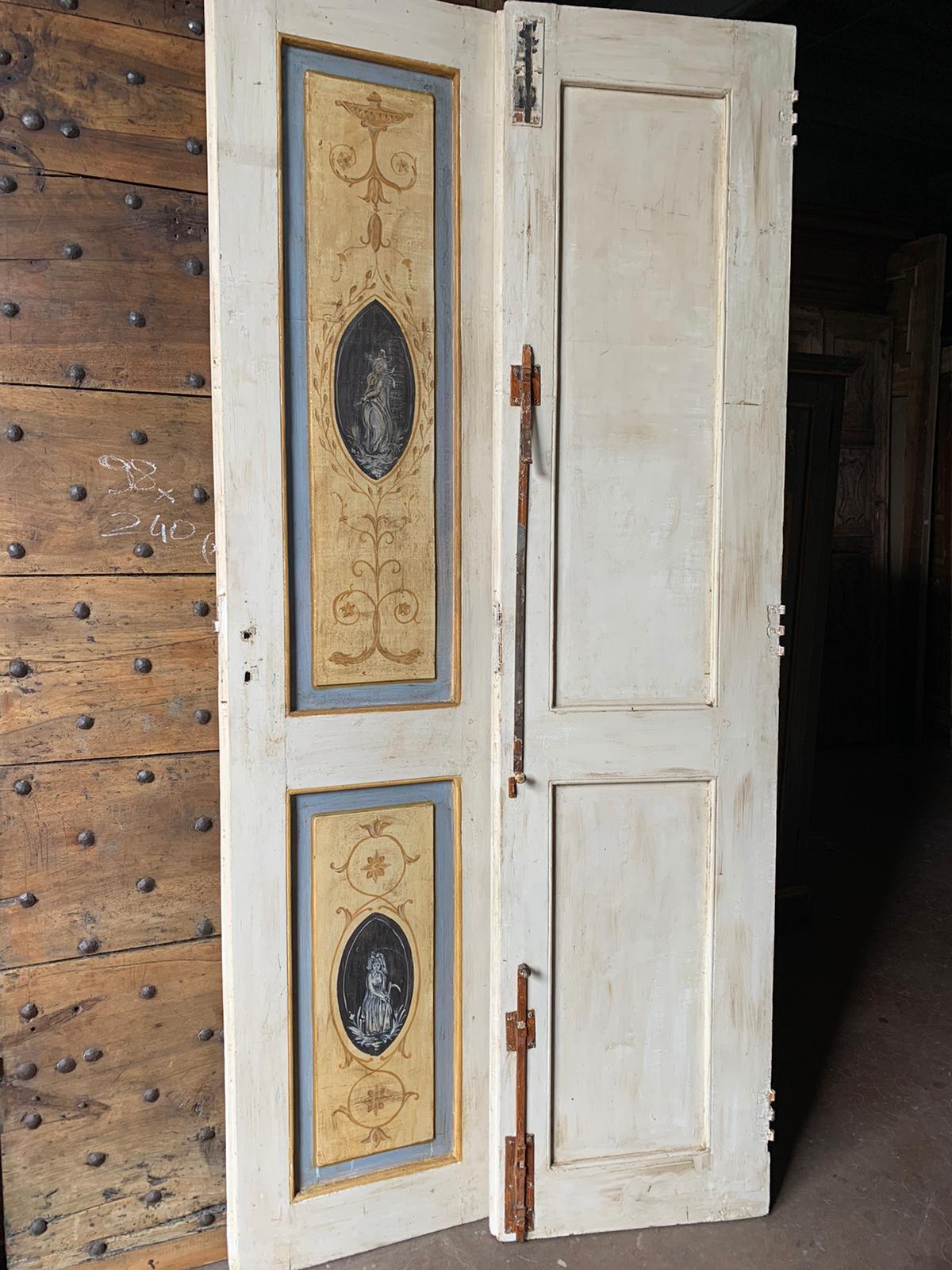 Ancient double door, painted in the panel with main colors yellow white, also lacquered on the back but simpler, with original irons but without frame, hand-built in the 18th century in Italy.
Also ideal for adaptation to slide.