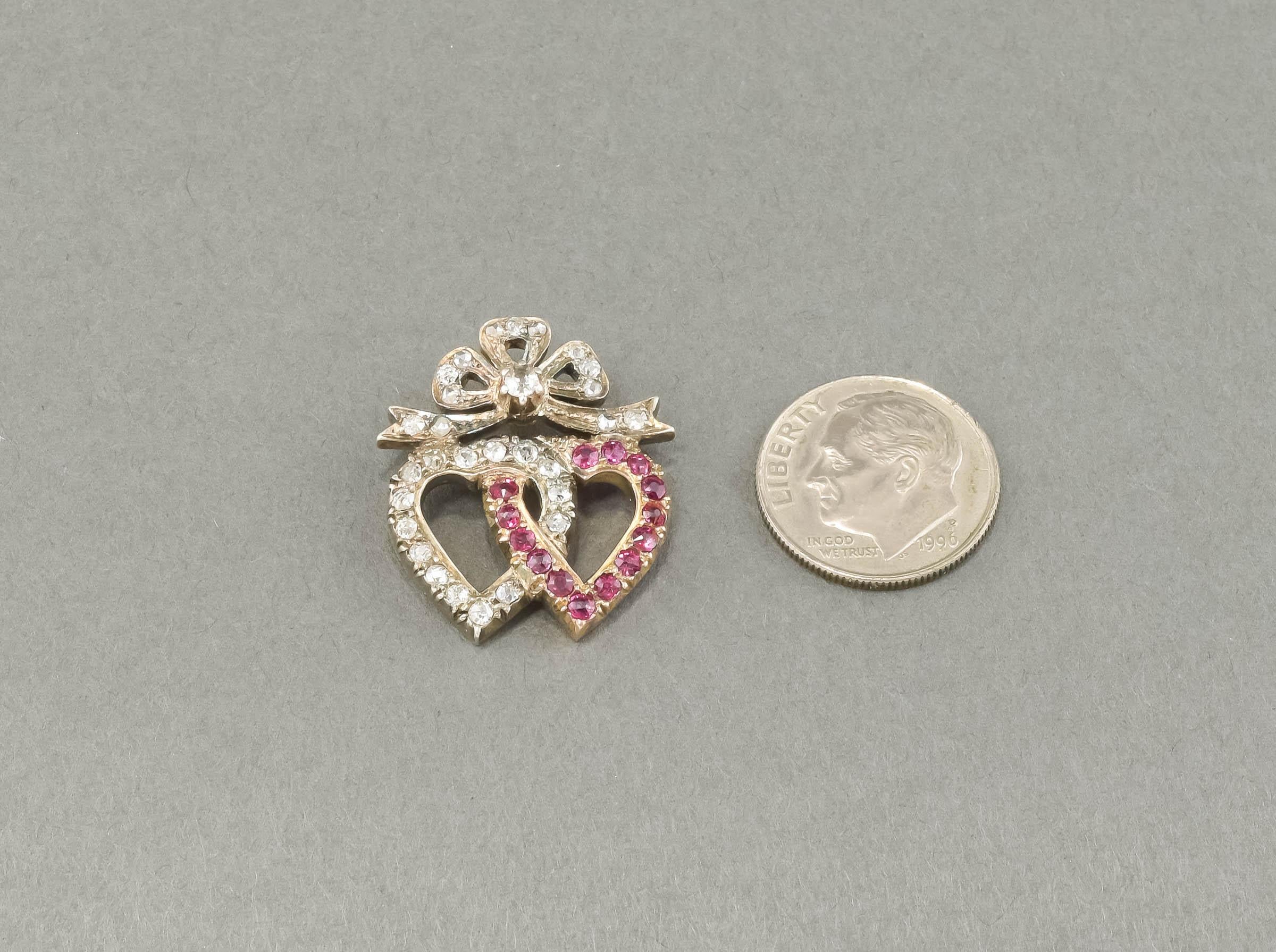 Sparkly and sentimental, this elegant diamond & ruby Double Heart was once part of a late Victorian brooch/pin.  I've converted it to an easy to wear pendant by adding a hidden gold bail on the reverse and removing the old pin stem and
