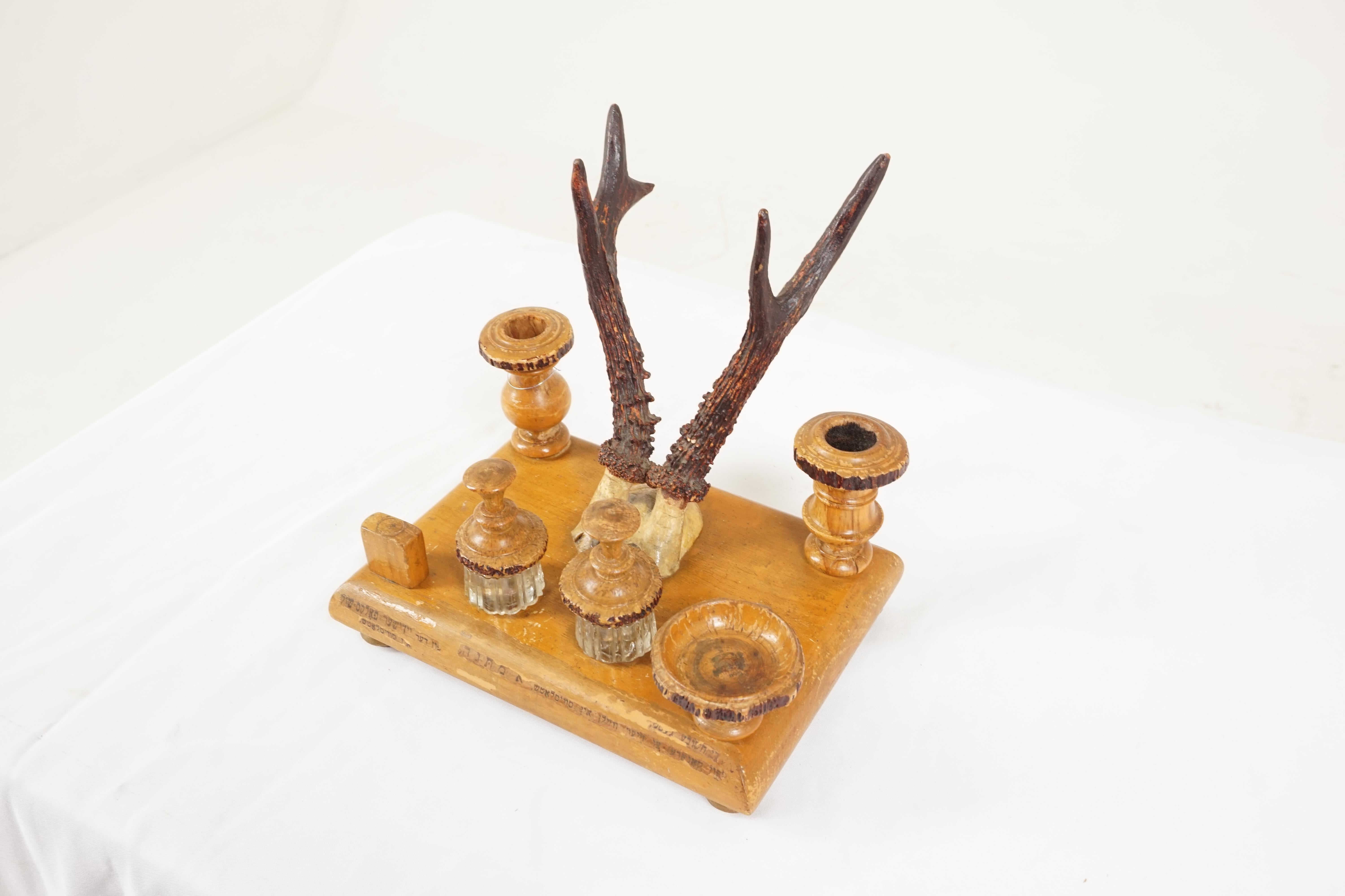 Antique double inkstand, carved wood and antlers, Middle Eastern 1930, H564

Middle Eastern
Wood + horn
Wooden base with bun feet
Having two glass inkwells with wooden tops
Two antler pen holders
Stamp holder, candlestick and a brush
