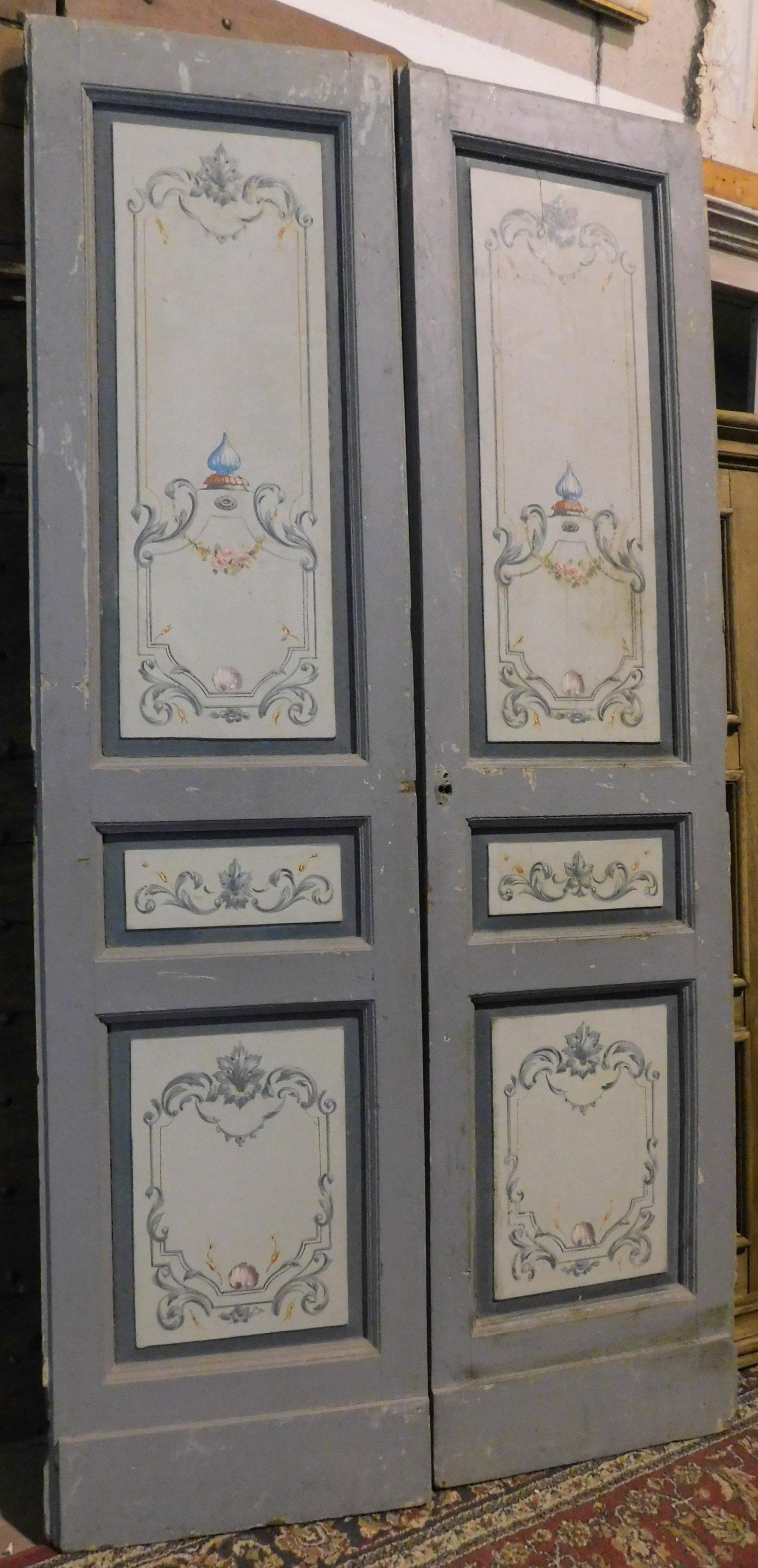 Antique double interior door, painted with typical decorations of the time on a gray-blue background, white back, hand-built in the middle of the 19th century in Italy.
The height can be used perhaps in industrial interiors, as a door (also