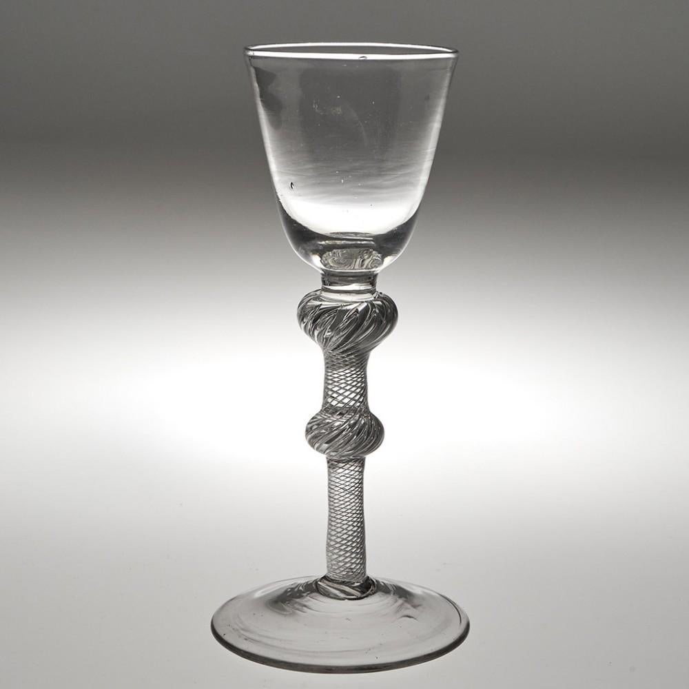 Antique Double Knop Composite Stem Wine Glass, c1750

Additional information:
Period : George II
Origin : England 
Colour : Clear 
Bowl : Round funnel
Stem : A short plain stem section above an air twist stem with inverted baluster and medial ball