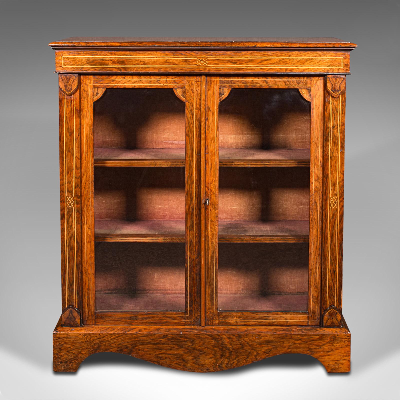 This is an antique double pier cabinet. An English, tiger mahogany glazed display cupboard, dating to the Regency period, circa 1820.

Graced with delightful inlaid detail and rich colour
Displays a desirable aged patina and in very good