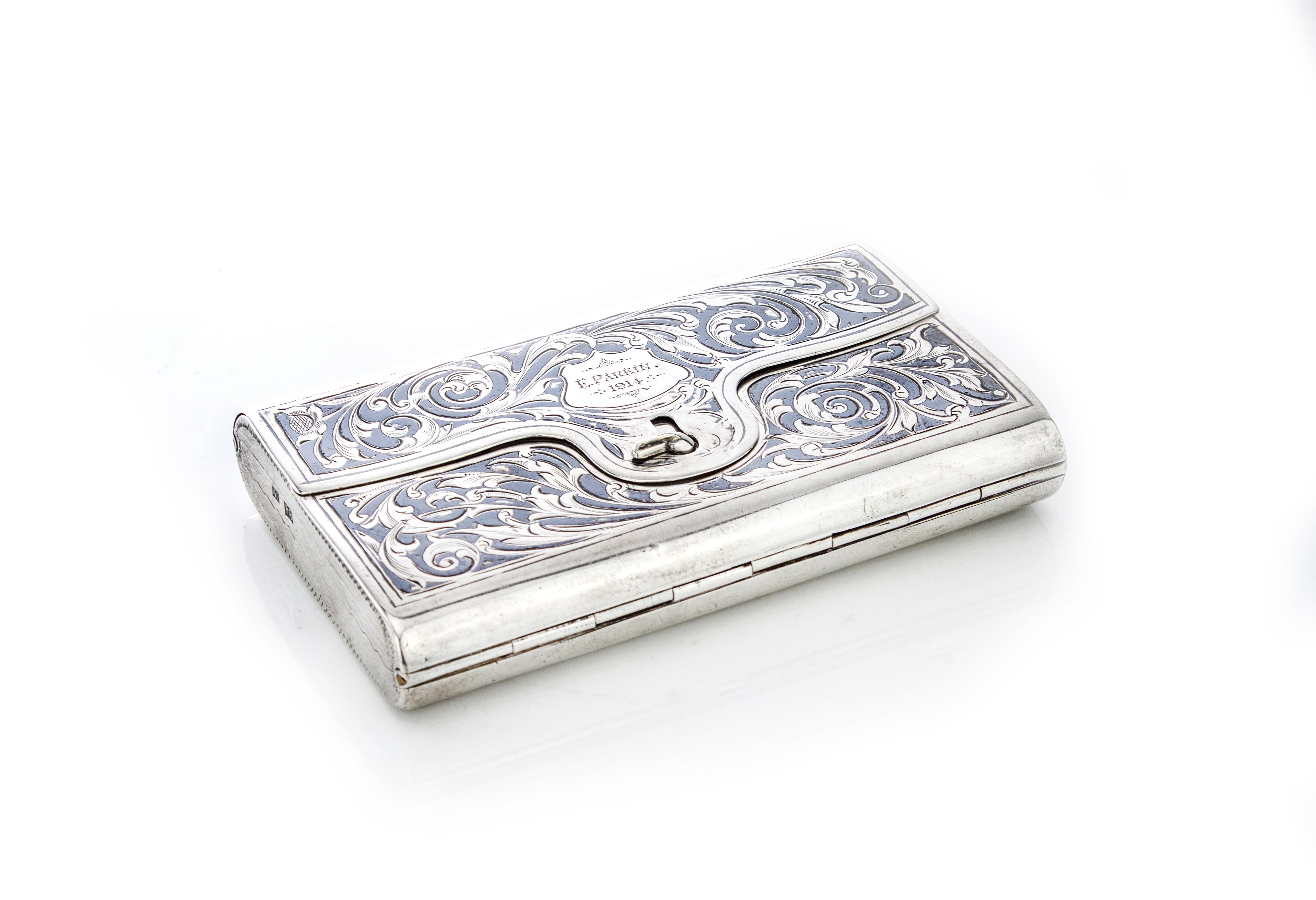 Antique Russian silver double sided cigarette case with niello decoration

The top has engraving E.Parkin 1914, the reverse has a niello decorated scene of a large square with monumental buildings.

Made in Russia, Moscow, 1865
Maker: AE (