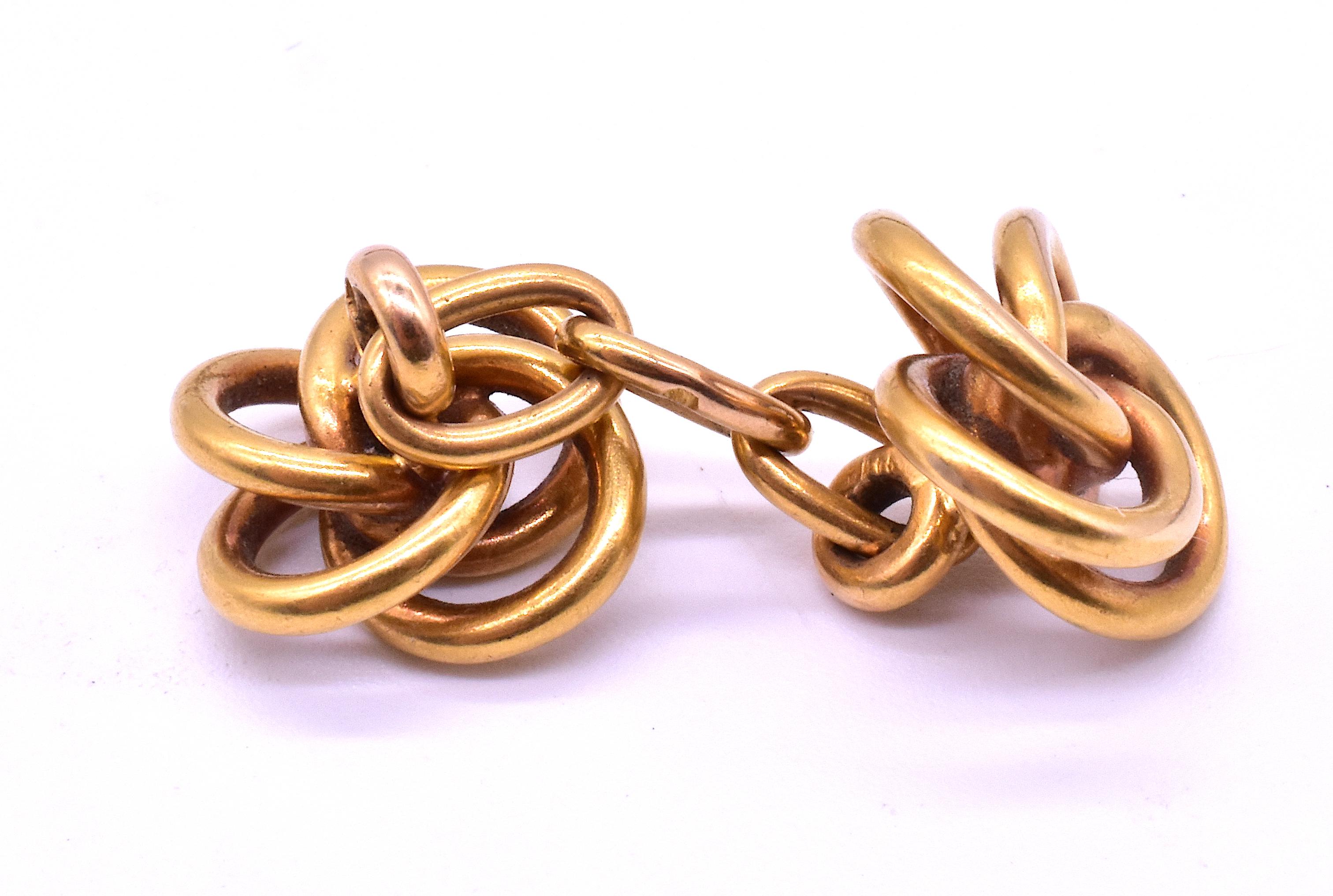 Classic 14 Karat double sided knot shaped gold cufflinks. The love knot dates to antiquity, symbolizing love, friendship and affection. The simple knot, lacking a beginning, middle or end, evokes the eternal connection and unbreakable bond between