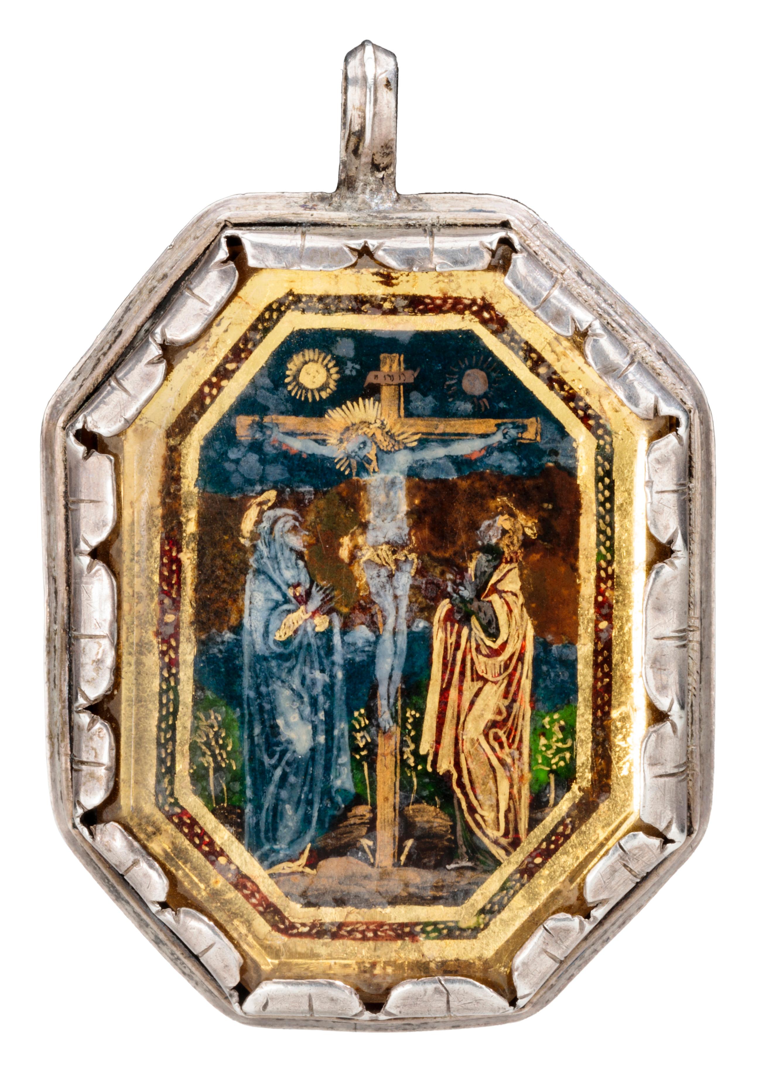 PENDANT WITH THE CRUCIFIXION AND ST. JOHN THE BAPTIST  
Italy (Lombardy), c. 1550–80  
Silver rock crystal, gold foil, verre églomisé  
Weight 23.7 grams; dimensions 47 × 32 × 10 mm

Double-sided octagonal pendant with two verre églomisé plaques