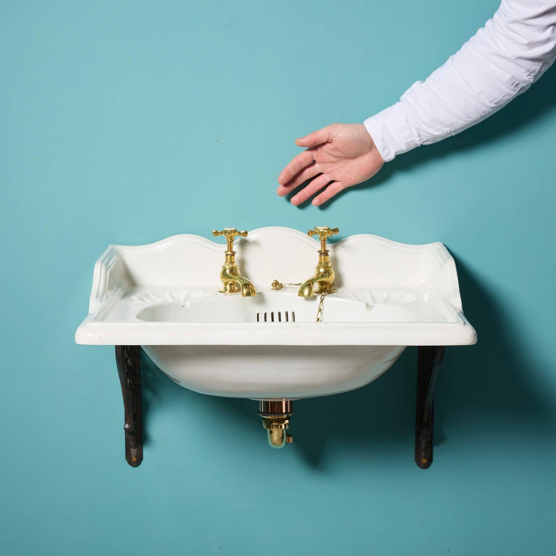 An antique Doulton & Co sink with cast iron wall brackets from the Simon Kirby Museum of Bathroom Sanitaryware collection.

Dating to circa 1890, this antique sink has a graceful form with an elegant, shaped splash back and moulded soap