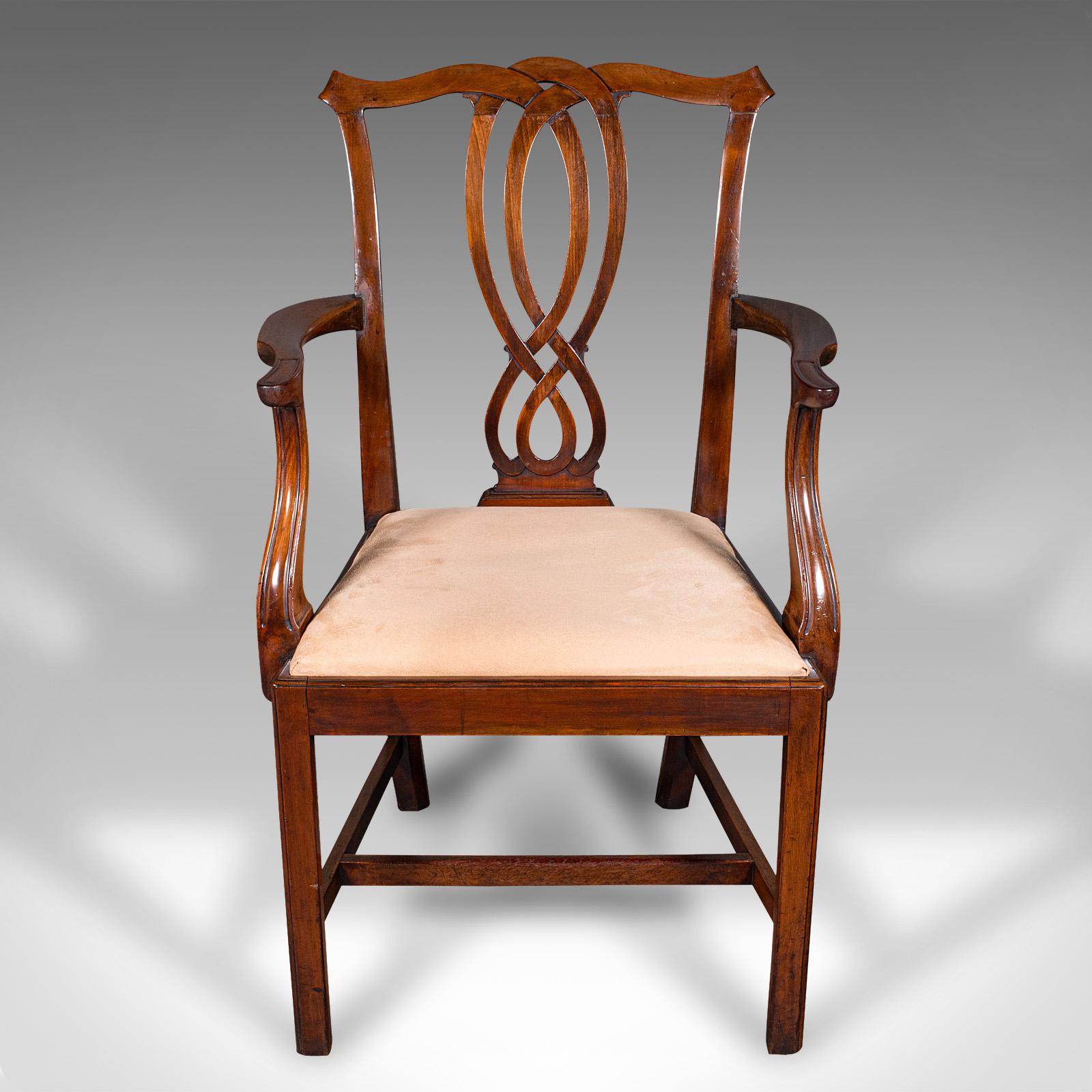 
This is an antique drawing room elbow chair. An English, mahogany carver in Chippendale taste, dating to the Georgian period, circa 1800.

Endearing Chippendale taste with pleasing colour and craftsmanship
Displaying a desirable aged patina and in