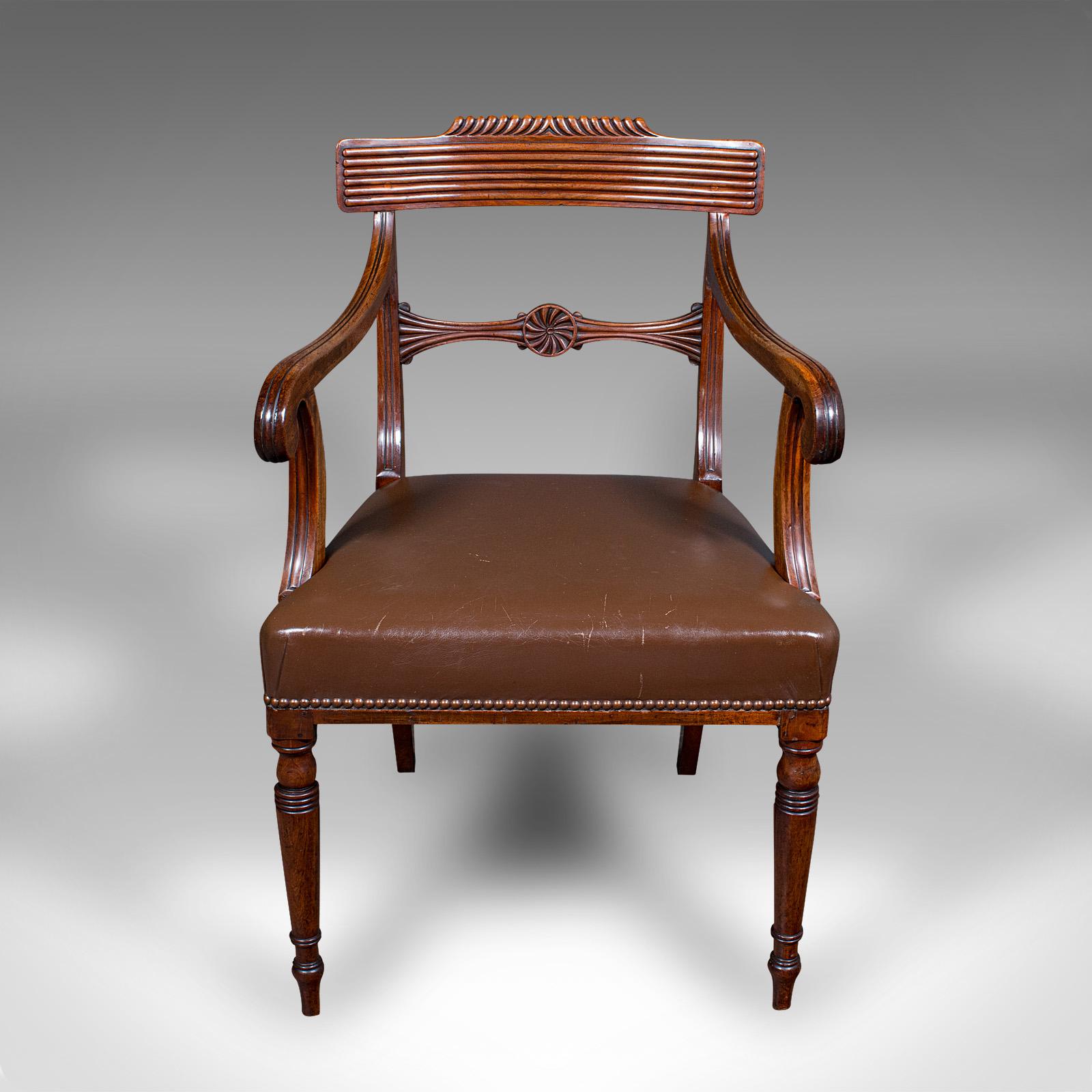 This is an antique drawing room elbow chair. An English, mahogany and leather desk seat, dating to the Regency period, circa 1820.

Fine Regency example with good taste and elegance
Displays a desirable aged patina and in good order
Select stocks
