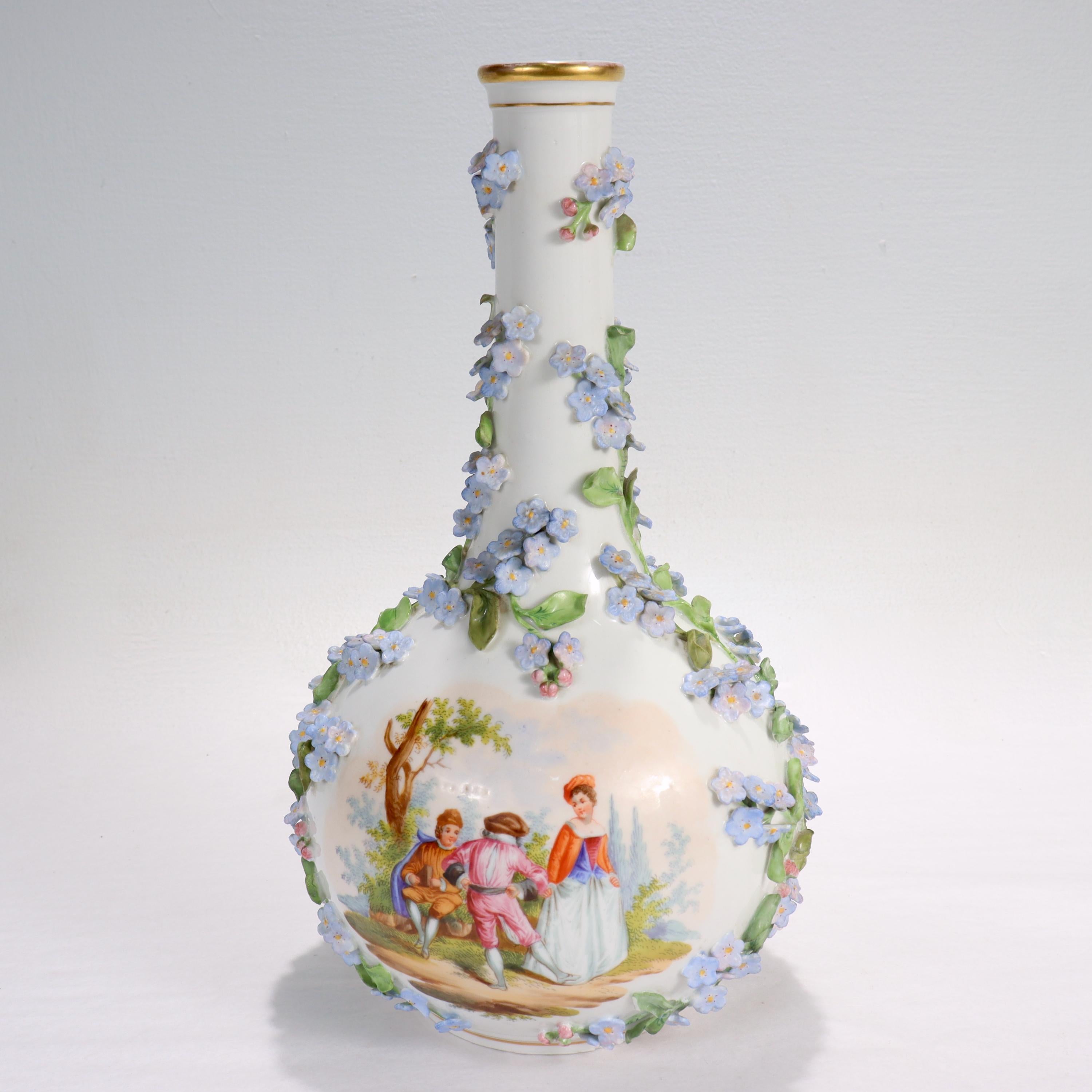 A fine antique Dresden porcelain vase.

By Thieme Potschappel.

Decorated throughout with encrusted porcelain flowers and painted scenes. One side of the bottle is painted with flowers, the other with a scene of 3 children in colonial/medieval