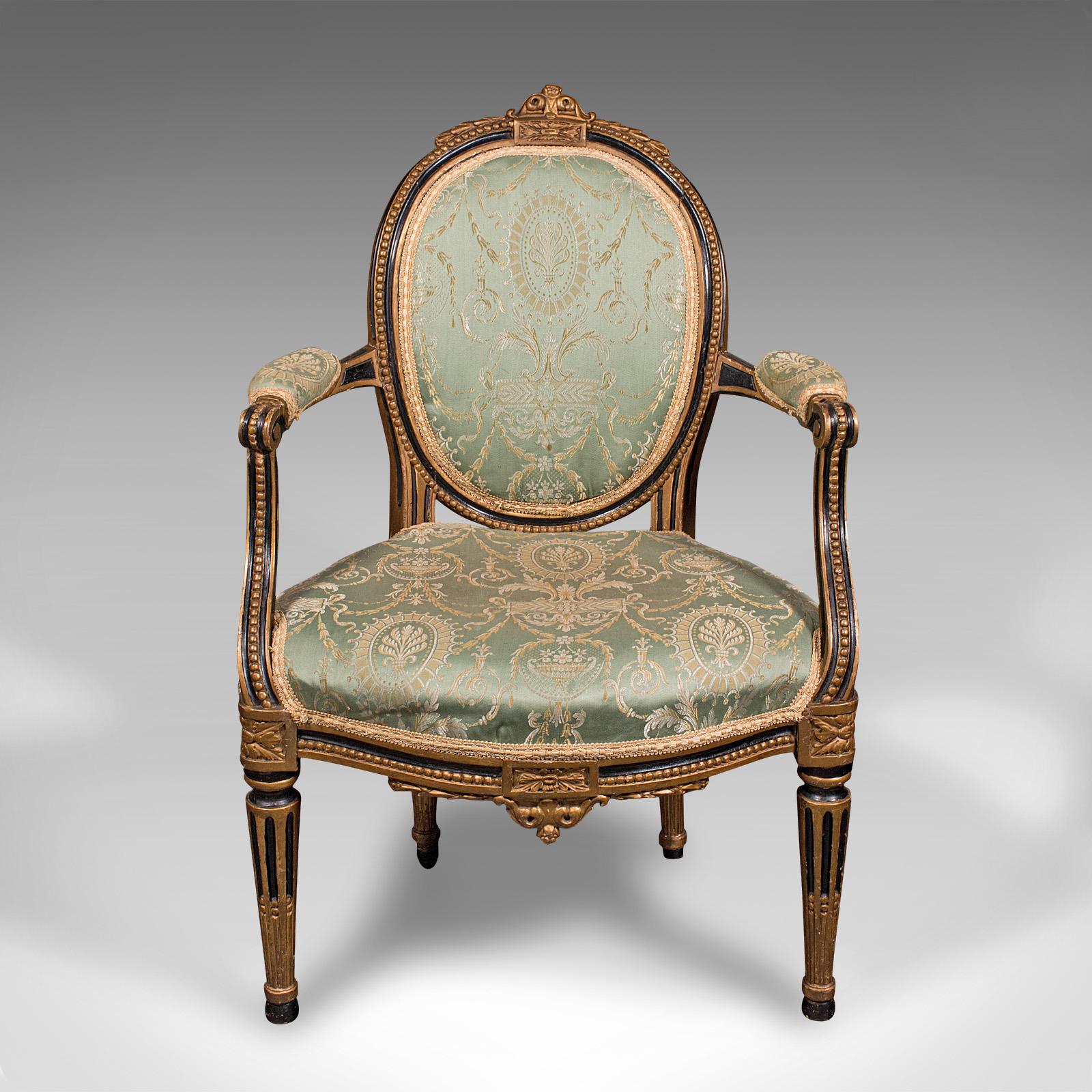 This is an antique dressing room armchair. An English, gilt finished elbow chair with silk cotton upholstery, dating to the Regency period, circa 1820.

Superb elegance, with a wonderful upholstery and gilt finish
Displays a desirable aged patina