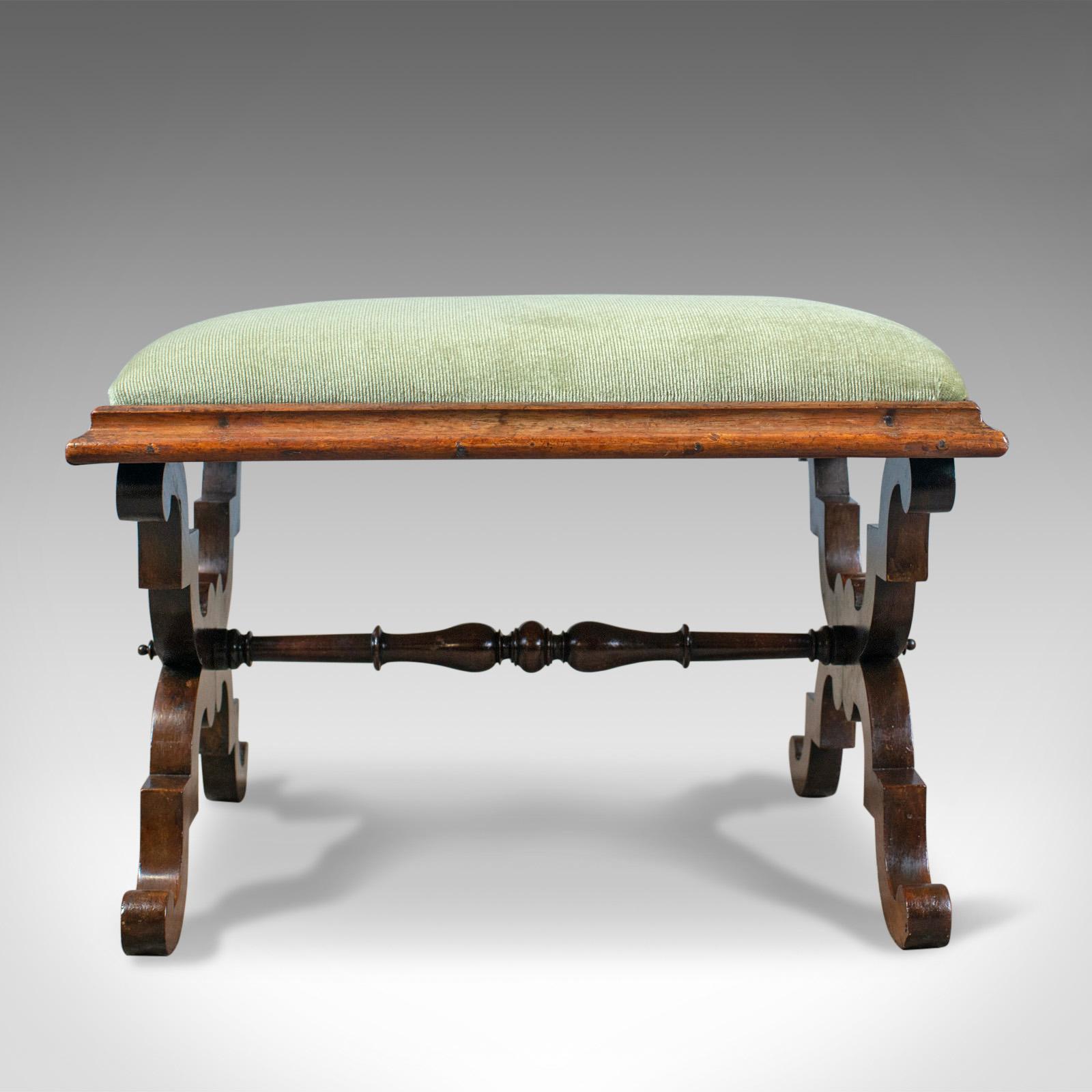 This is an antique dressing stool in rosewood with an olive green velour cloth. An English foot stool dating to the Regency period of the early 19th century, circa 1820.

Attractive, warm tones to the rosewood frame
Grain interest with a