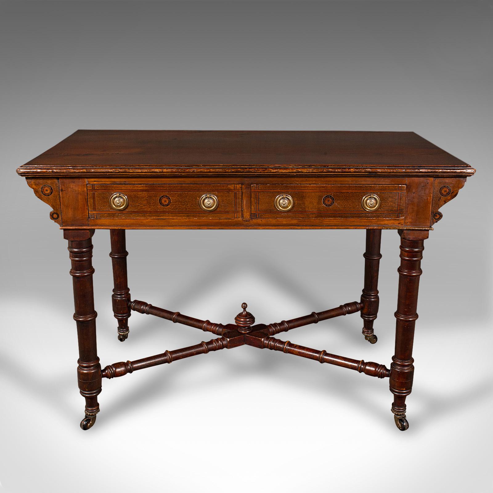 

This is an antique dressing table. An English, oak and pine two drawer writing or console table, dating to the late Victorian period, circa 1900.

Appealing late Victorian craftsmanship with a charming appearance
Displays a desirable aged patina