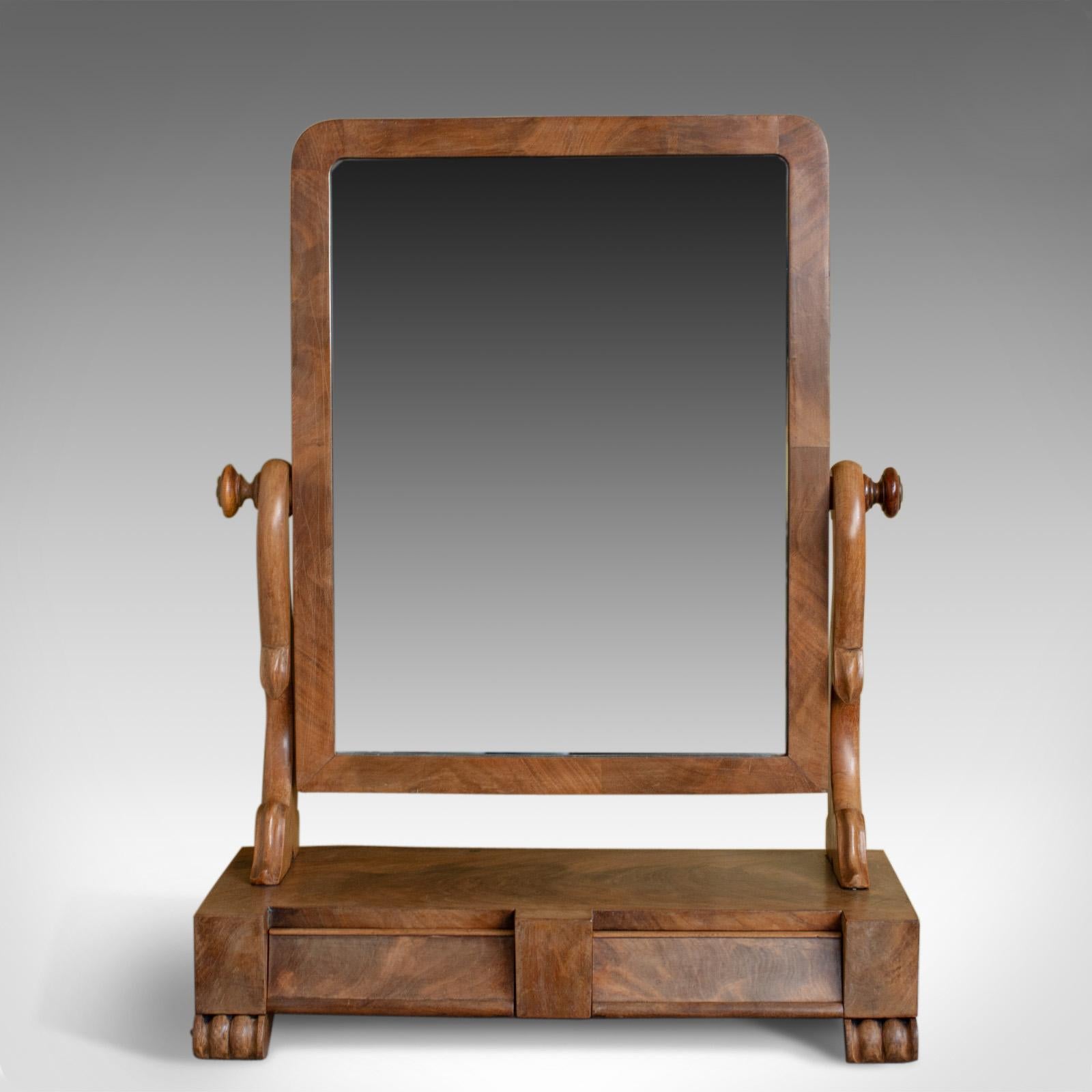 This is an antique dressing table mirror, an English, Victorian mahogany, adjustable swing mirror dating to circa 1870.

Of fine quality in mahogany with grain interest throughout
Good consistent color and a desirable aged patina
Well figured