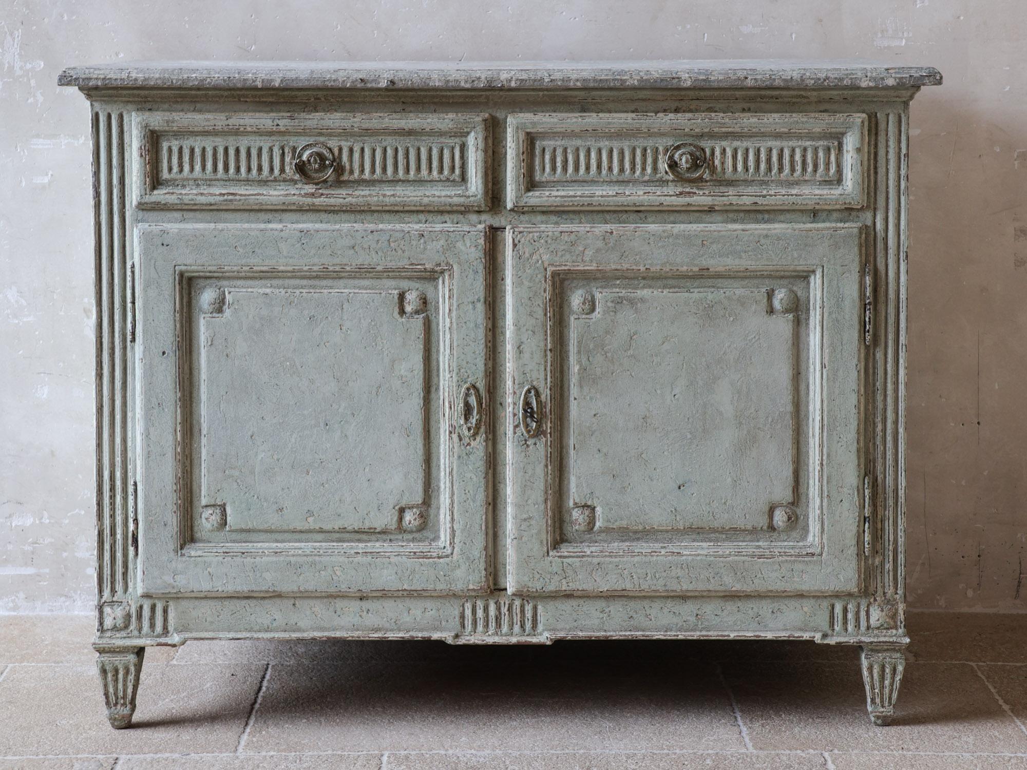 Antique chest or buffet from 19th-century France. This beautiful piece in Louis XVI style features an oak exterior patinated in aged gray with a marbled (patina) top and exquisite detailing on the drawers and legs.

Height: 105 cm
Width: 114