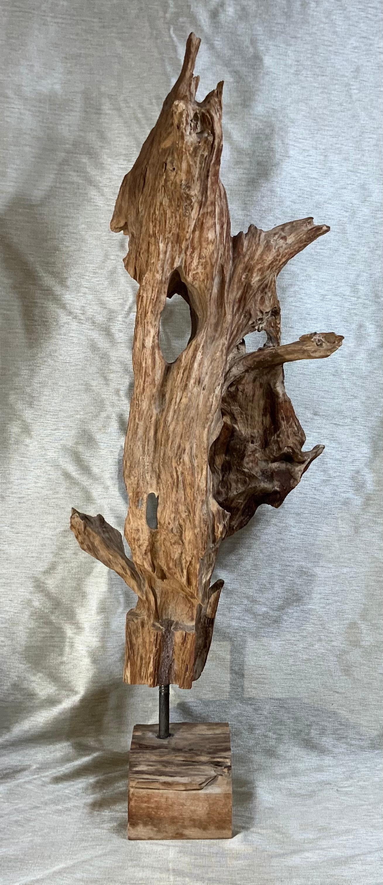 
This beautiful, carved, driftwood sculpture was made from part of single large tree. This important reclaimed tree root has a bleached natural finish and sits on a natural wood base professionally mounted with steel rod to secure it together. The