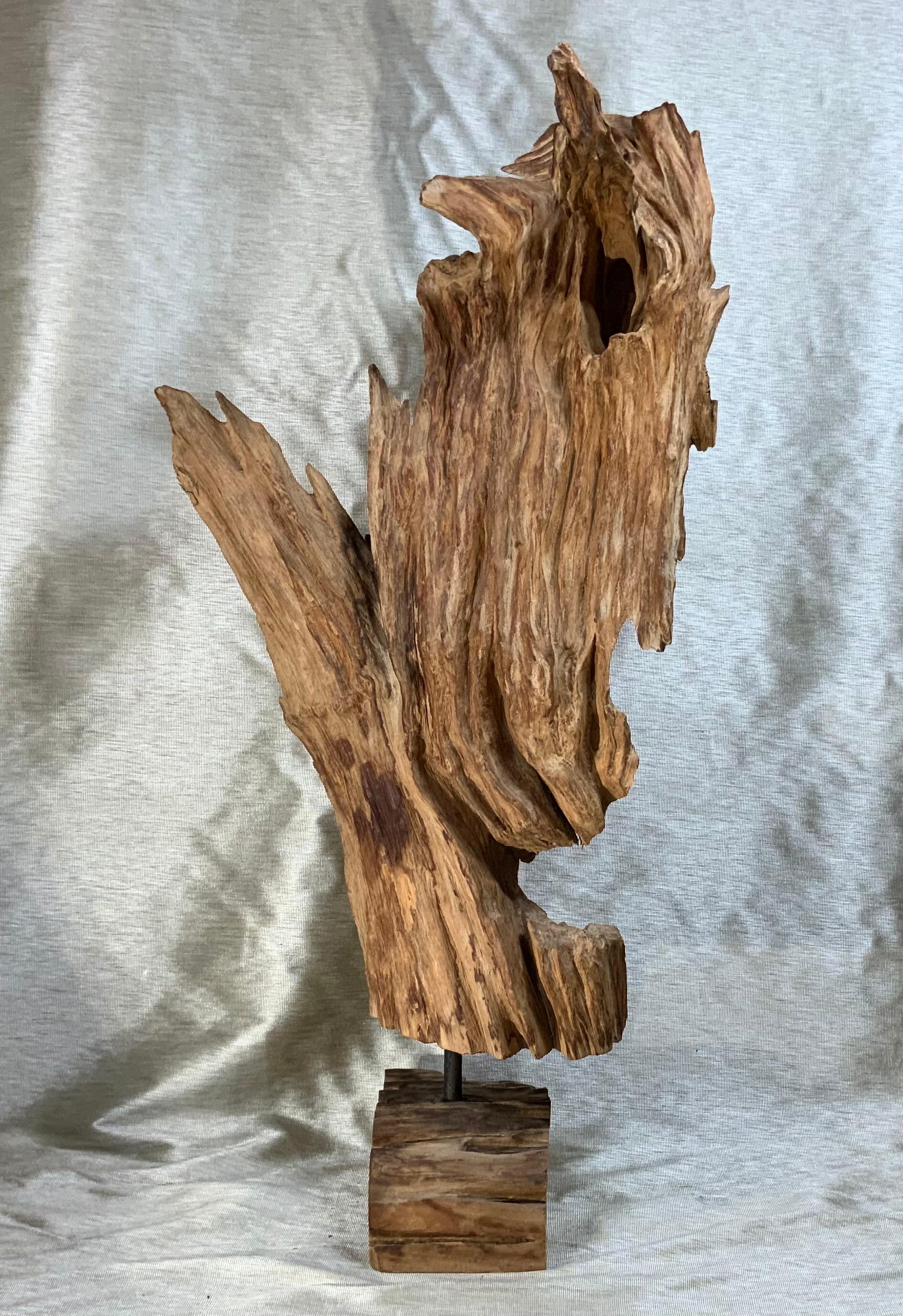 This beautiful, carved, driftwood sculpture was made from part of single large tree. This important reclaimed tree root has a bleached natural finish and sits on a natural wood base professionally mounted with steel rod to secure it together. The
