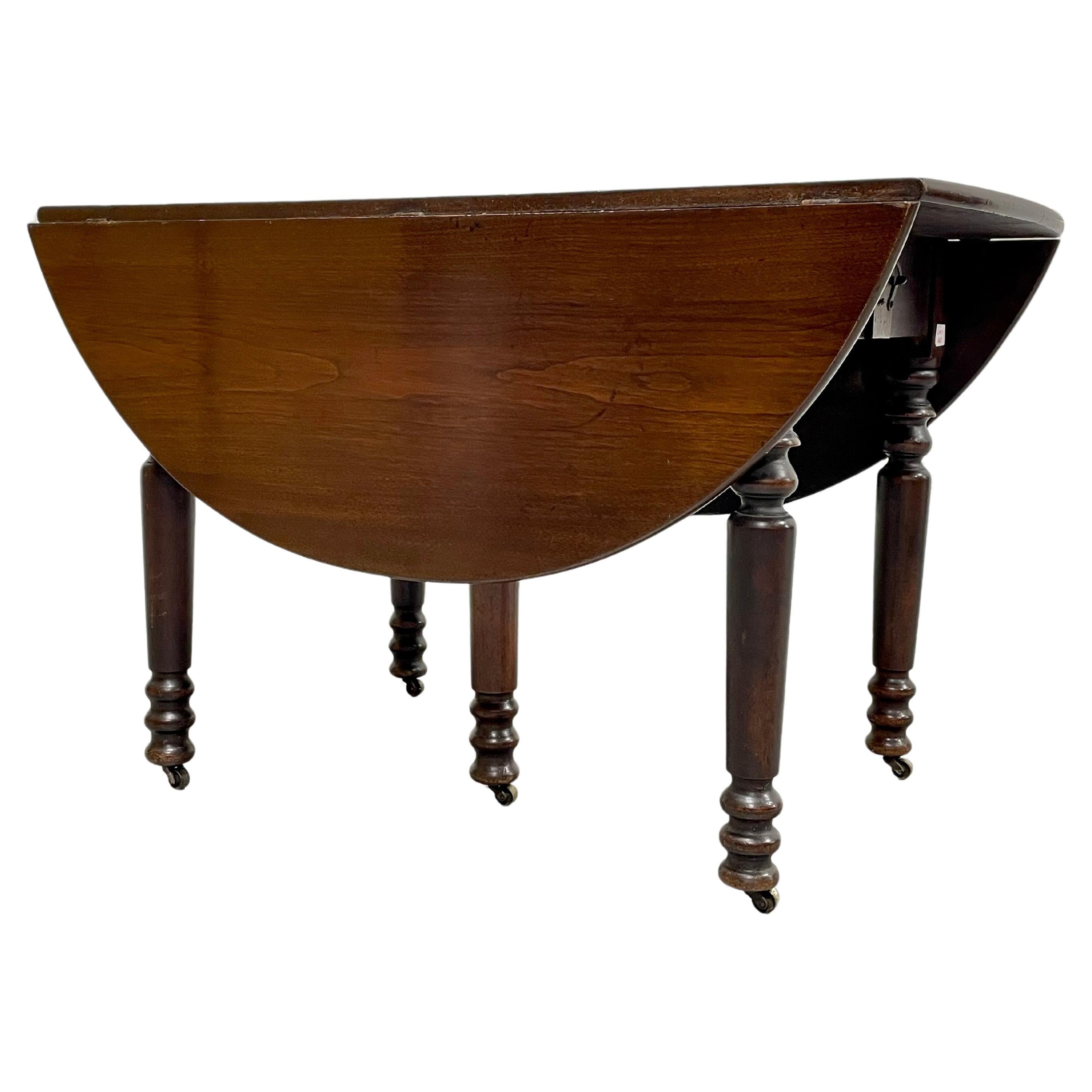 Antique Drop Leaf Expandable Mahogany Oval Dining Table, c. 1910 For Sale