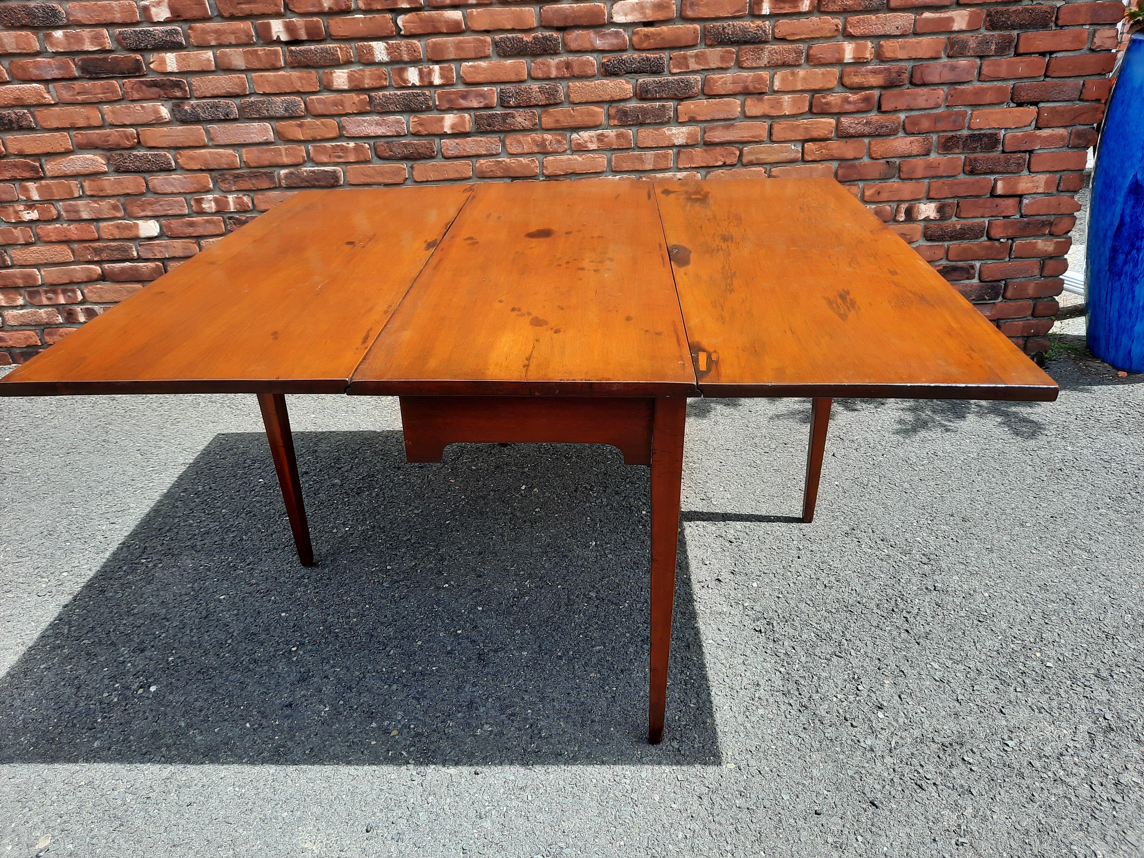 Antique solid hardwood drop leaf table with 2 gate legs that swing out to support the leaves when opened. The leaves do not have to be used at the same time. The table is very sturdy. Can also be used as a console table behind a sofa. Great space