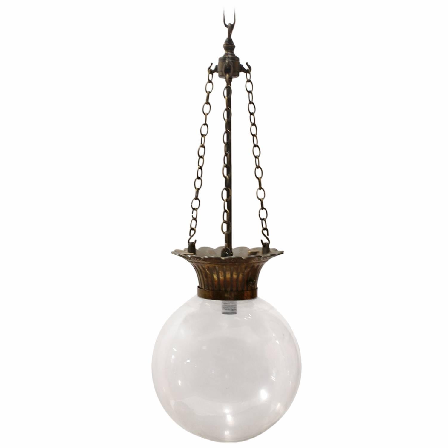 Antique Drugstore glass and bronze show globe chandelier. We have two available. Listed price is for each light. Rewired and in working condition.