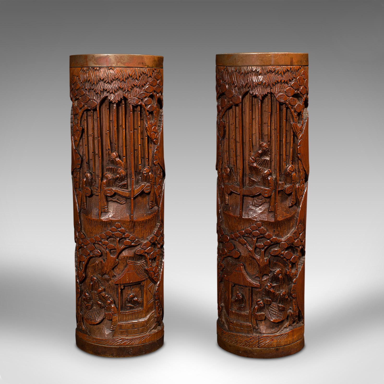 This is a large pair of antique dry flower vases. A Chinese, hand-carved bamboo stem sleeve or brush pot, dating to the late Victorian period, circa 1900.

Superb bitong or traditionally carved brush pots, ideal for dry flower