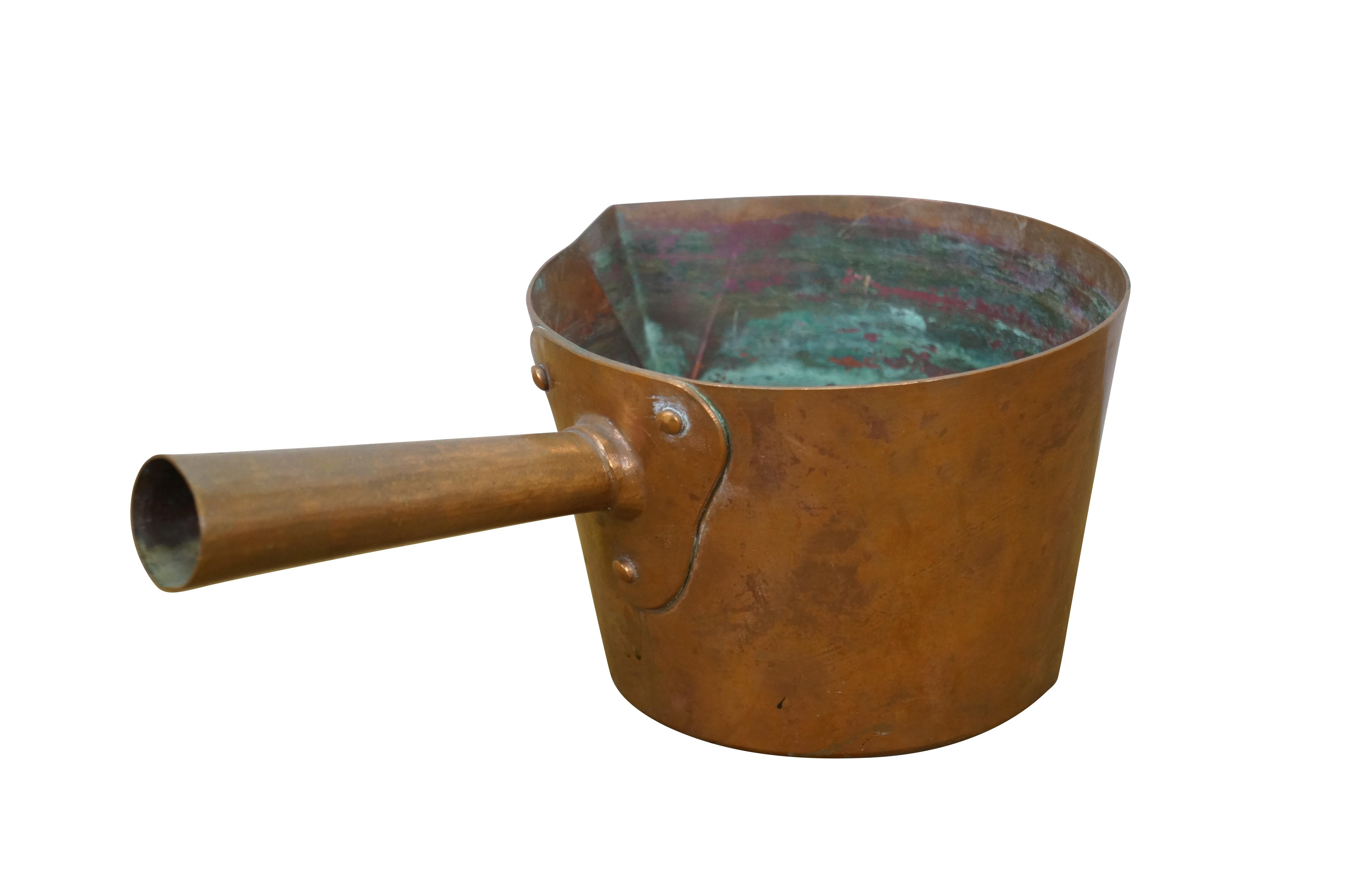 Mid 19th to early 20th century copper patisserie / sugar / candy making / jam pot by Duparquet, Huot & Moneuse Co. Round copper pan with slightly tapered base, triangular pour spout and hollow copper handle.

Dimensions:
12
