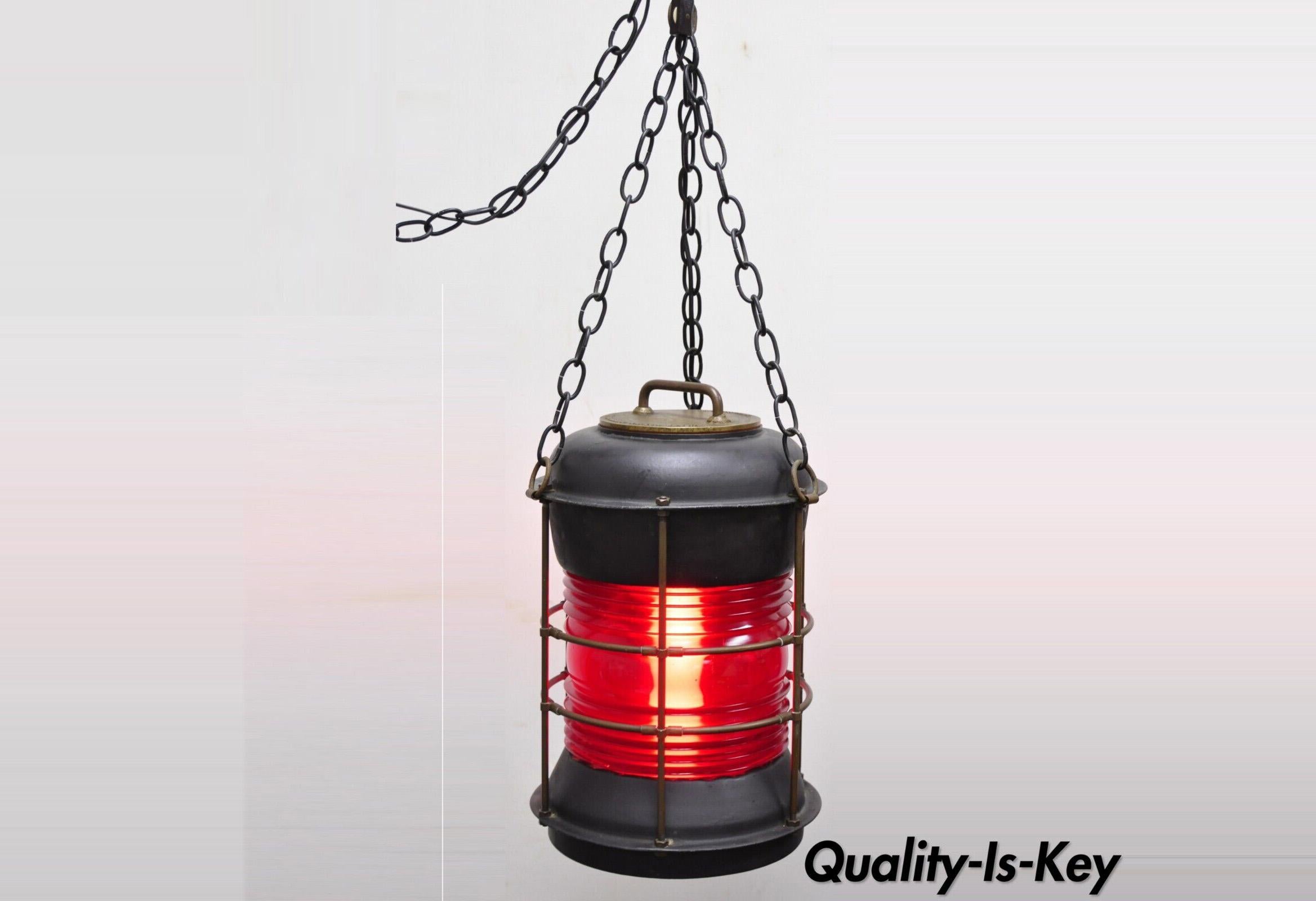 Antique Durkee marine ship lantern fixture red fresnel pendant chandlier (A). Item features 360 degree red glass fresnel lens, steel metal frame, original label, very nice antique item, quality American craftsmanship, converted into a functioning