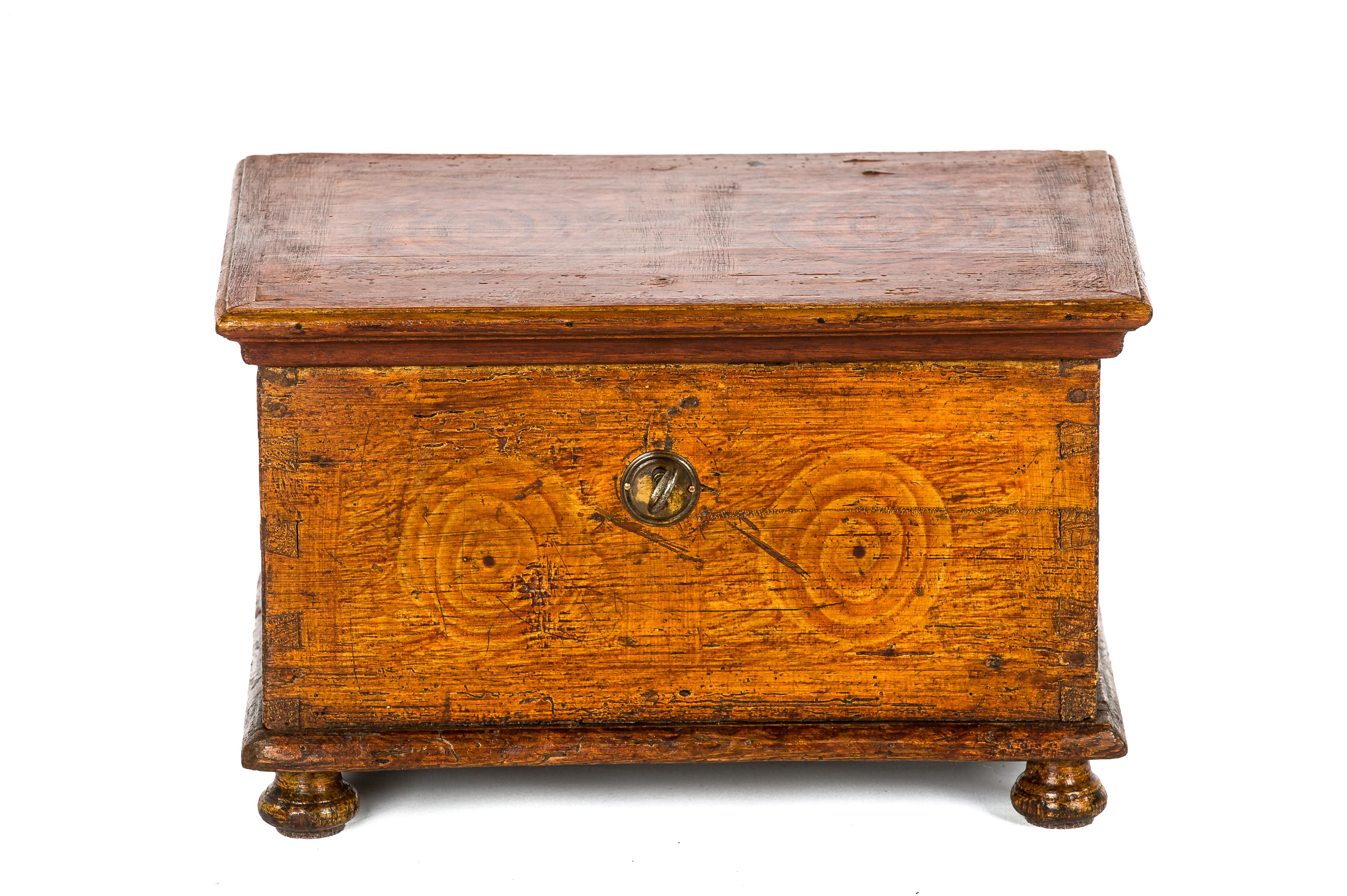 A rare small table trunk that was made in the Netherlands in the early 1800s. It is made of solid pine and it was painted in yellow ocher and ox-blood red. These are typical colors used for historic and folkloristic painted furniture in Staphorst,