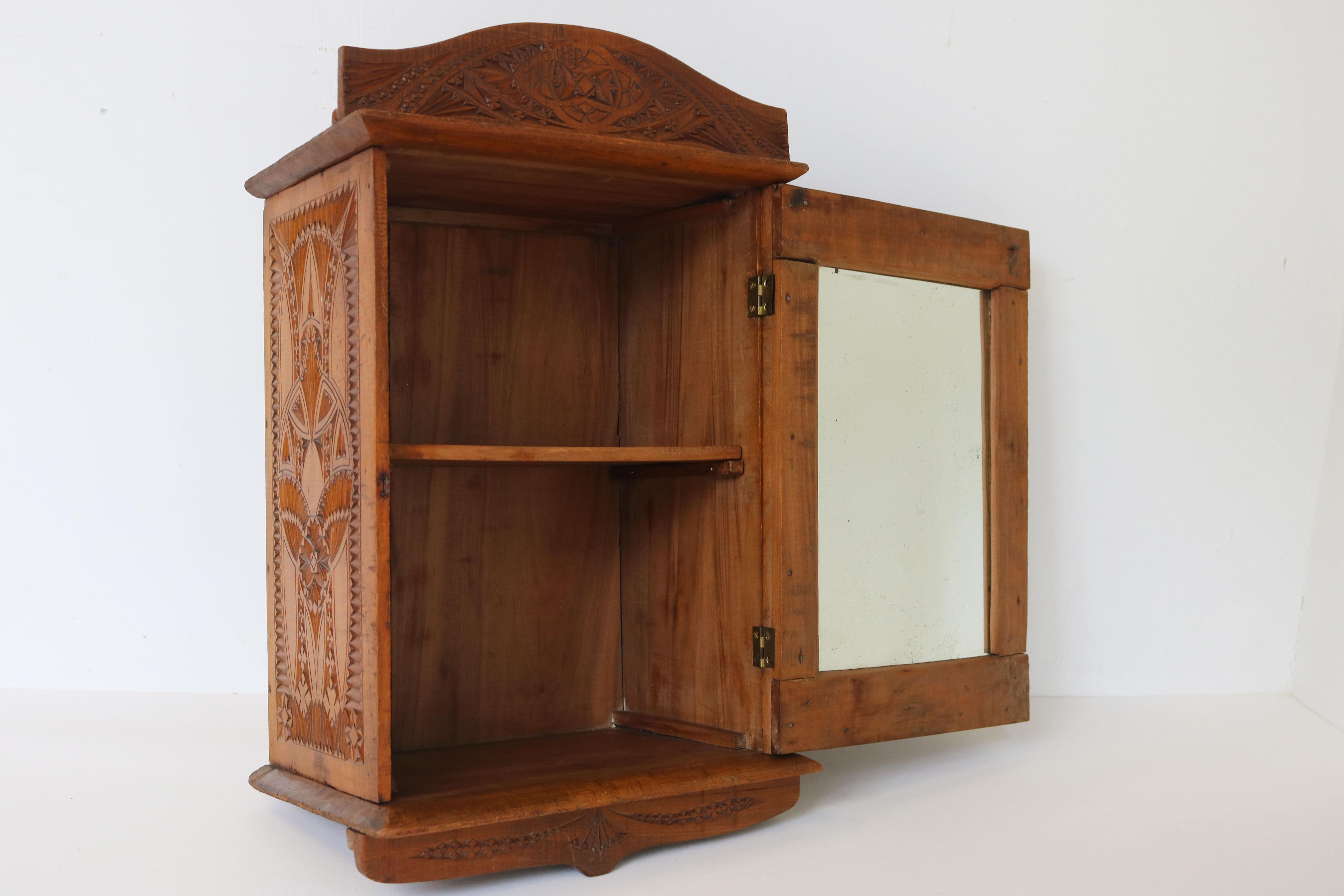 Wood Antique Dutch Arts & Crafts chip carved wall cabinet with mirror 1910 Folk art  For Sale