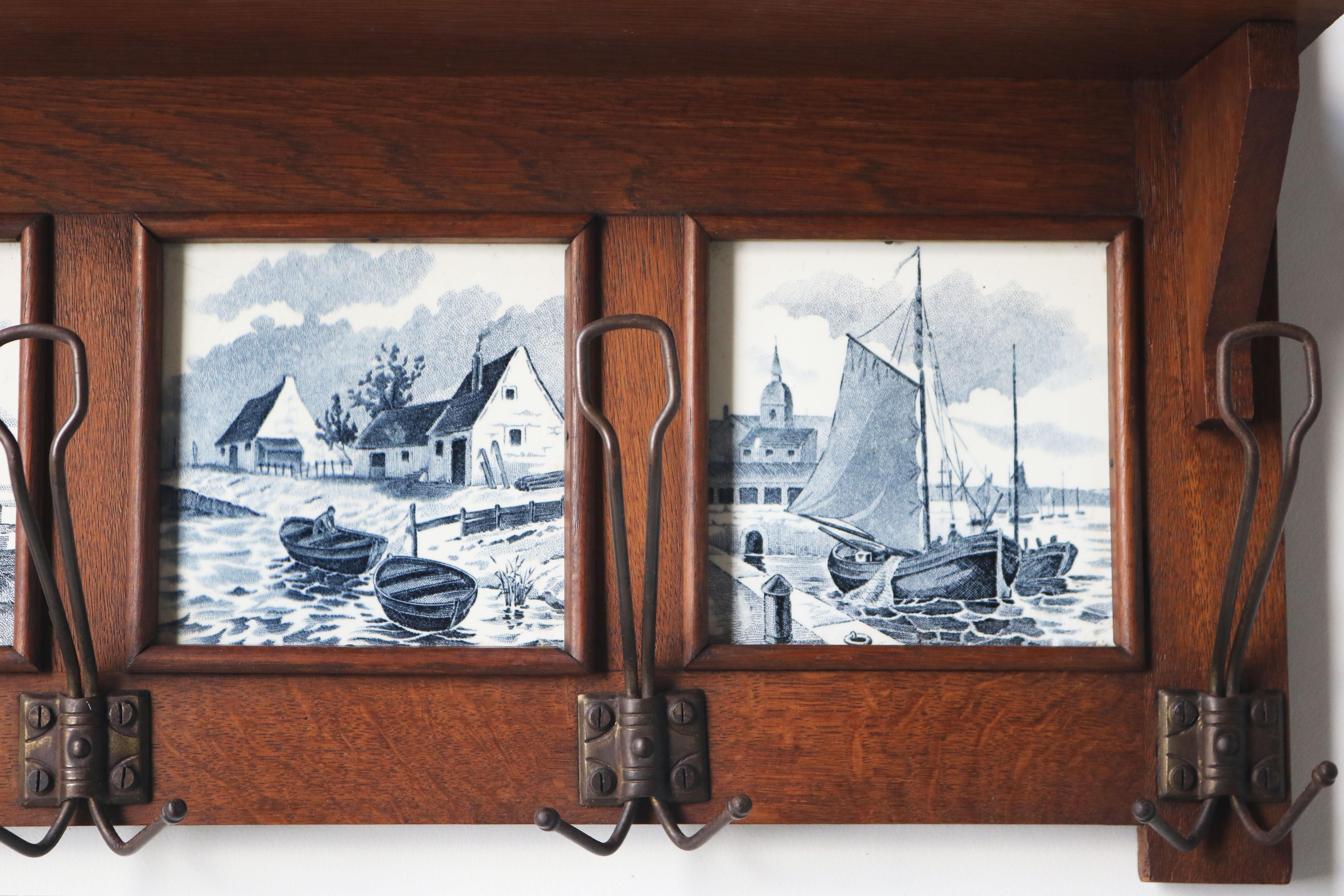 Hand-Carved Antique Dutch Arts & Crafts coat rack 1920 solid Oak Delft blue tiles