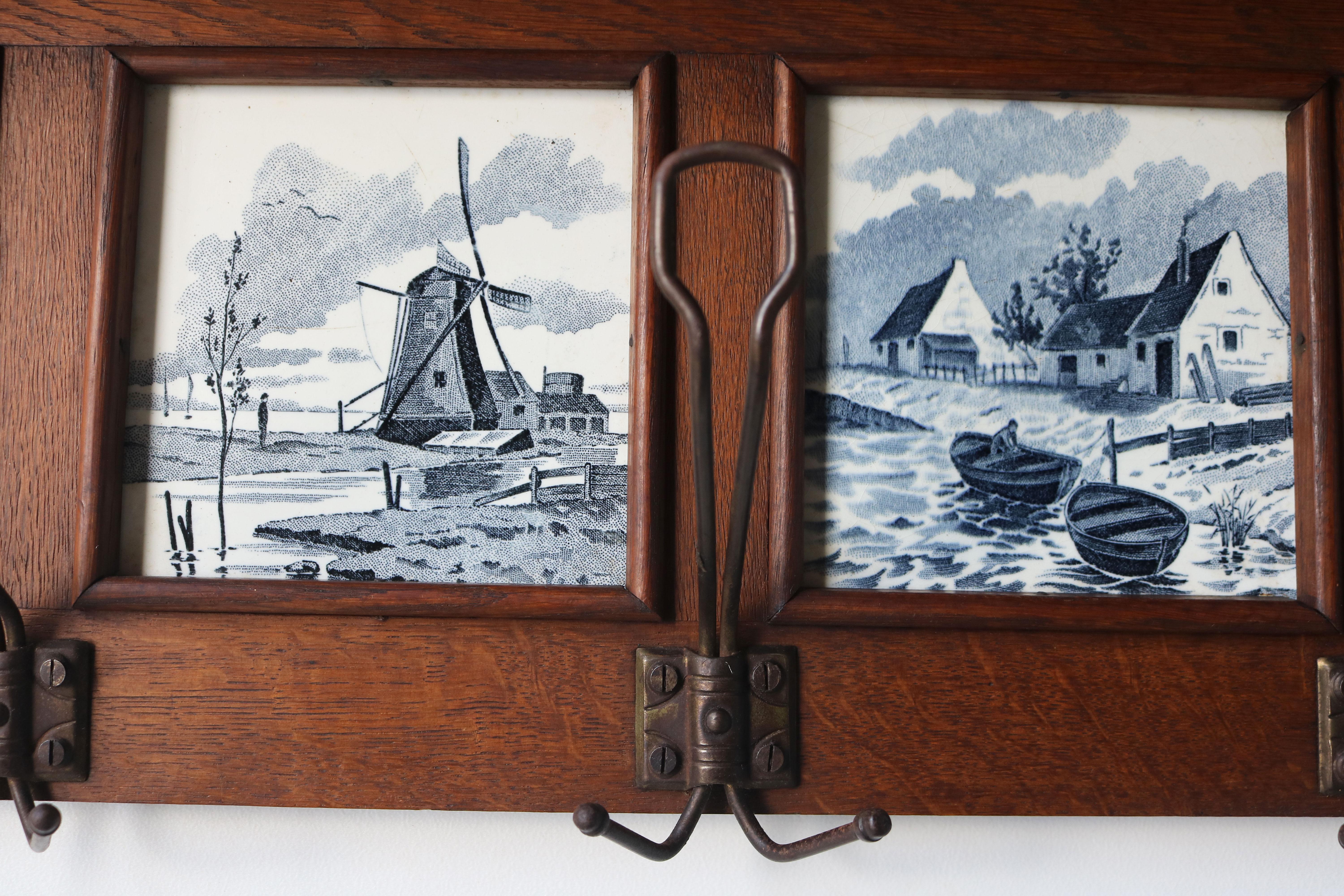 Antique Dutch Arts & Crafts coat rack 1920 solid Oak Delft blue tiles In Good Condition In Ijzendijke, NL