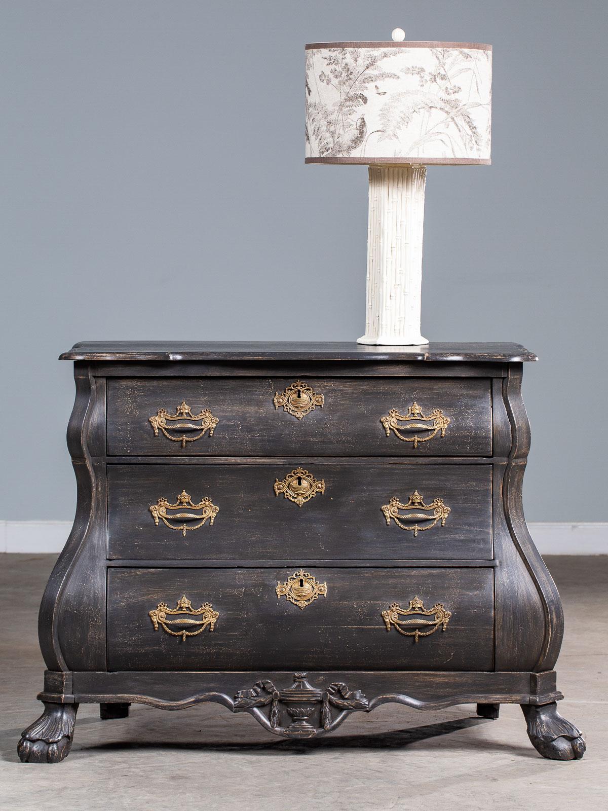 A classic Dutch bombé front painted mahogany chest of drawers from Holland, circa 1850. Please notice the shaped top having a serpentine front above the three cascading drawers. The drawers are graduated in size and each one features beautiful hand