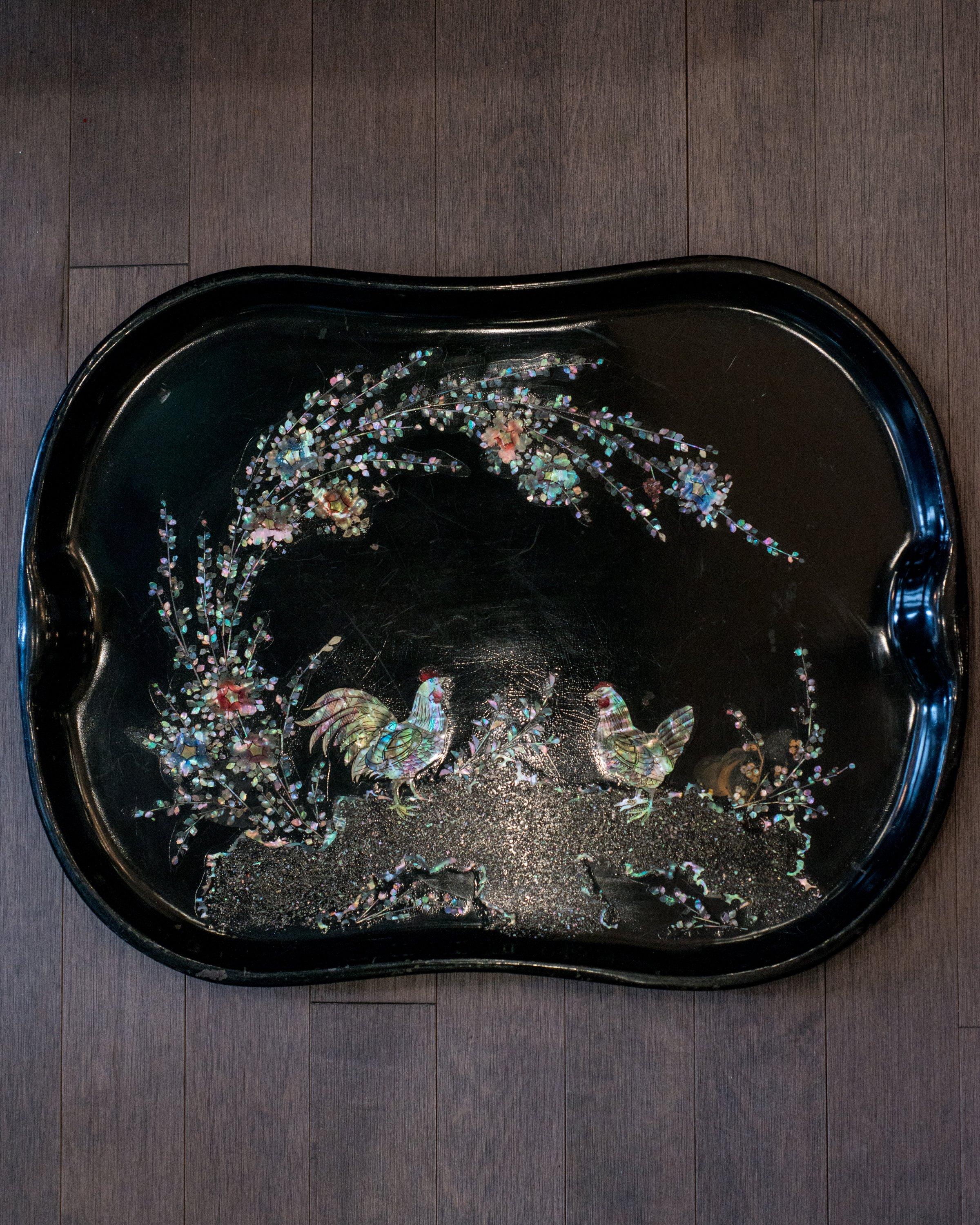 This unique antique Dutch metal tray with mother of pearl inlaid roosters was sourced on a trip to Holland.
