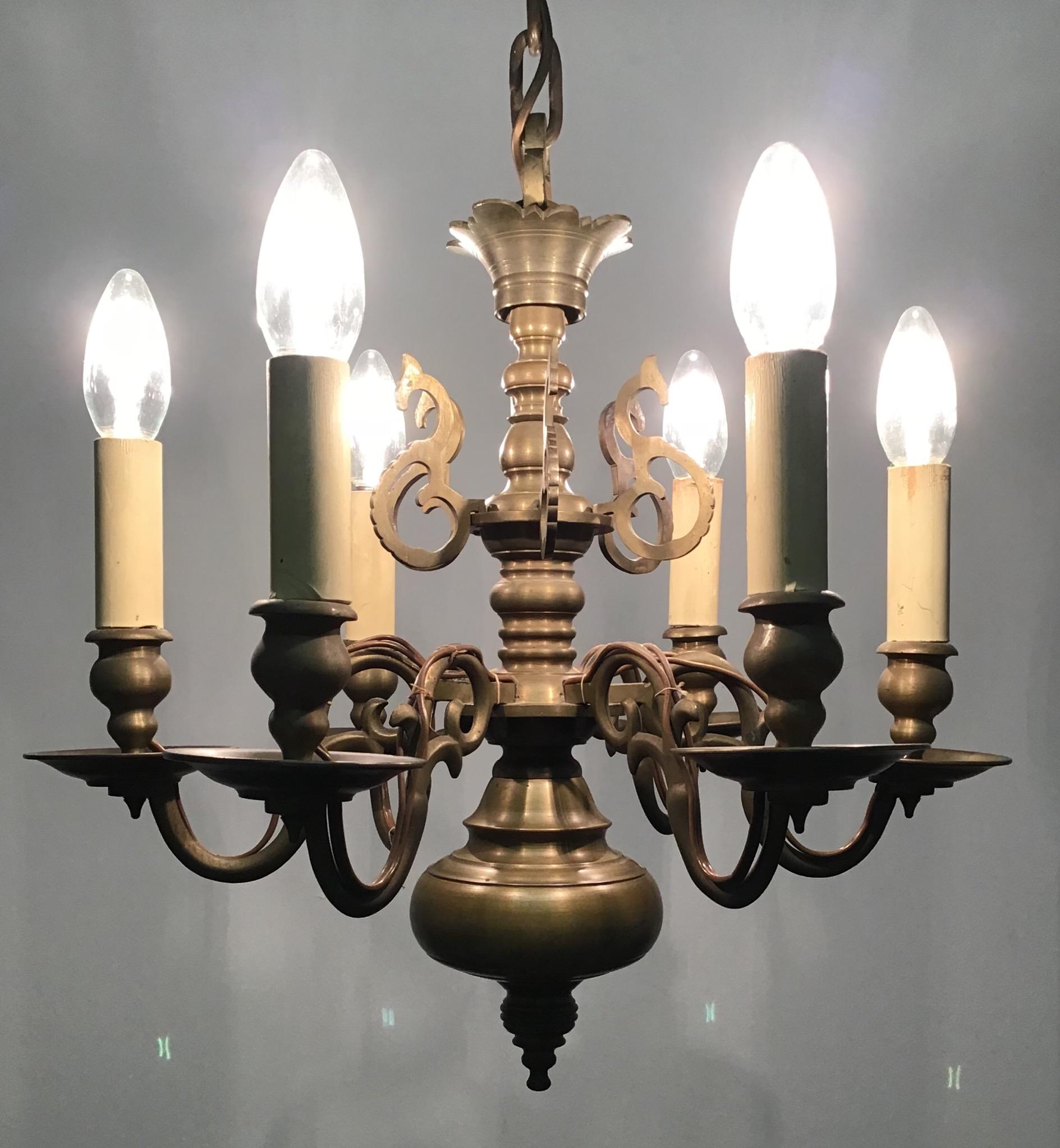 Dutch sold bronze chandelier made late in the 19th century and recently wired for electricity.
Solid brass six-light frame with wonderful old patina.
Rewired for US and in an excellent original condition.
Socket: Six E14 (for standard screw