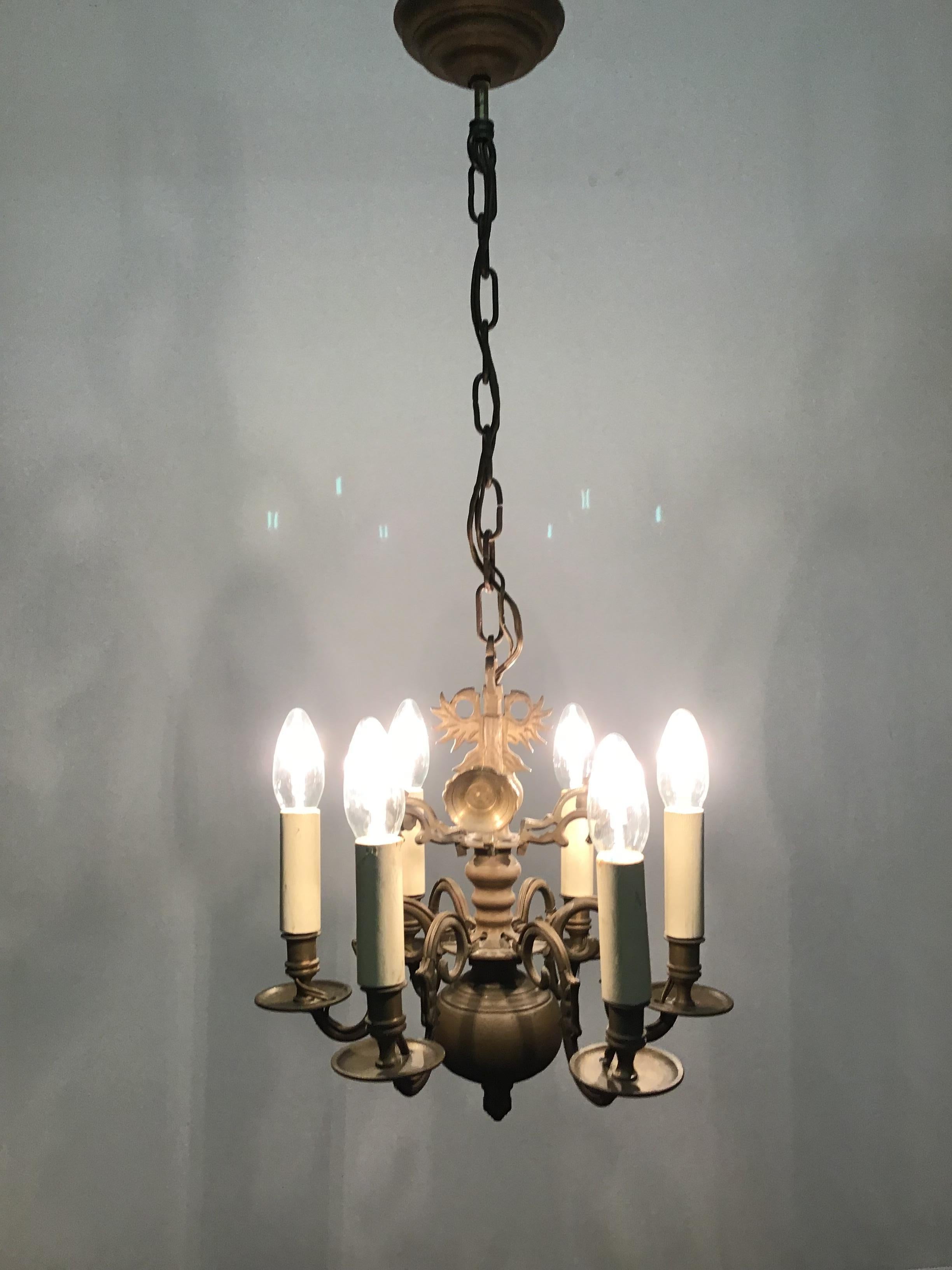 Small Dutch solid bronze chandelier made late in the 19th century and recently wired for electricity.
Solid brass six-light frame with wonderful old patina.
Rewired for US and in an excellent original condition.
Socket: Six E14 (for standard