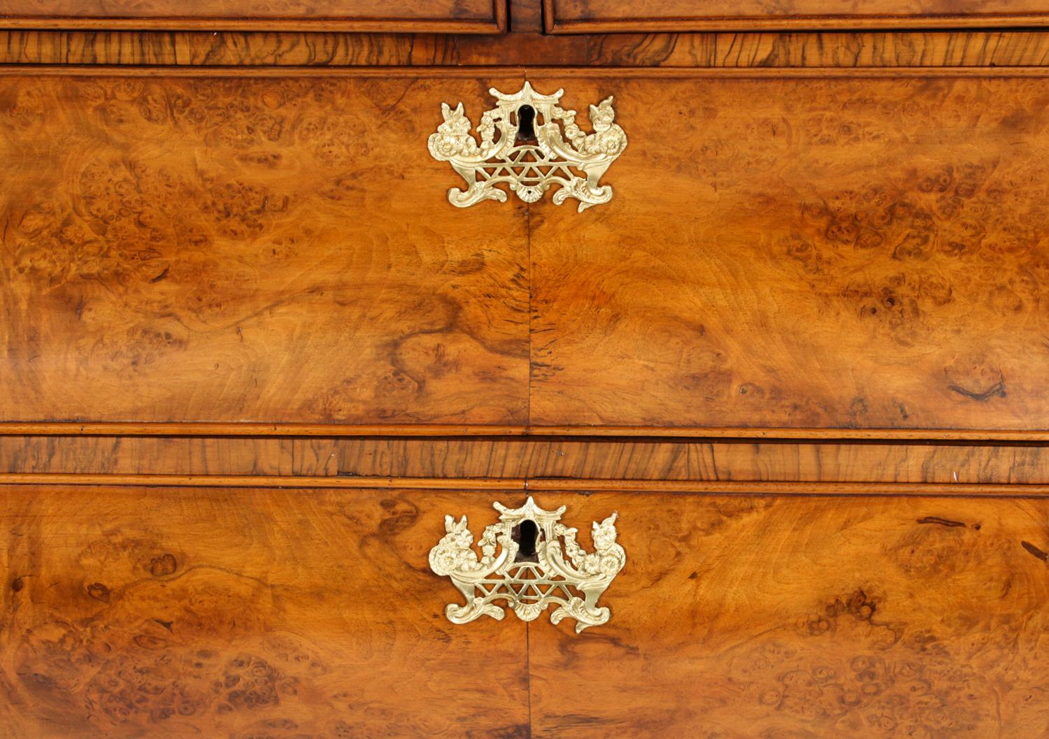 This is a superb antique Dutch Rococo burr walnut bombé Armoire, circa 1780 in date. 
 
It has been accomplished in stupendous burr walnut with masterfully hand carved mouldings. The drawer linings are of solid oak, it stands on its original hand
