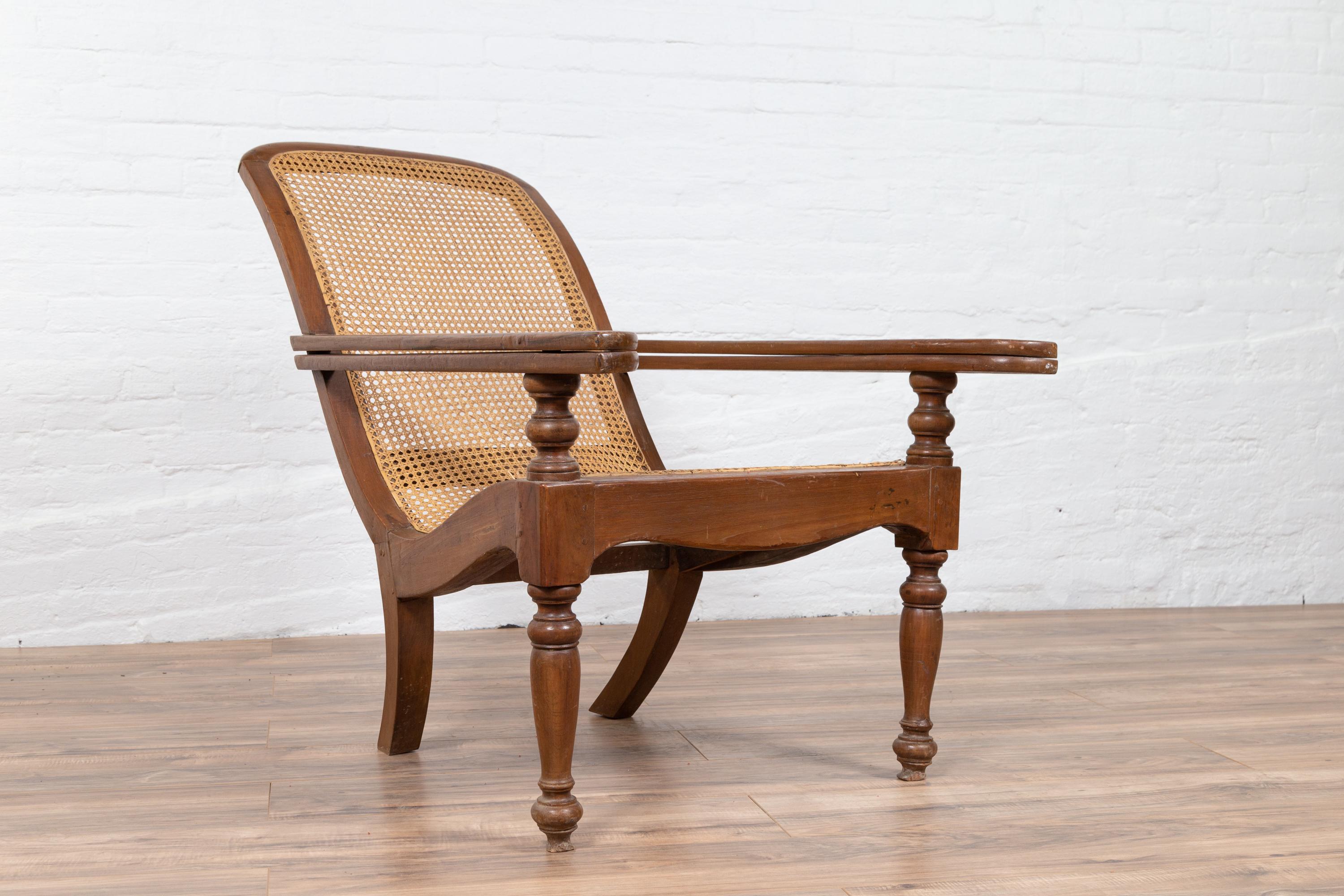 Indonesian Antique Dutch Colonial Plantation Lounge Chair with Curving Seat and Rattan